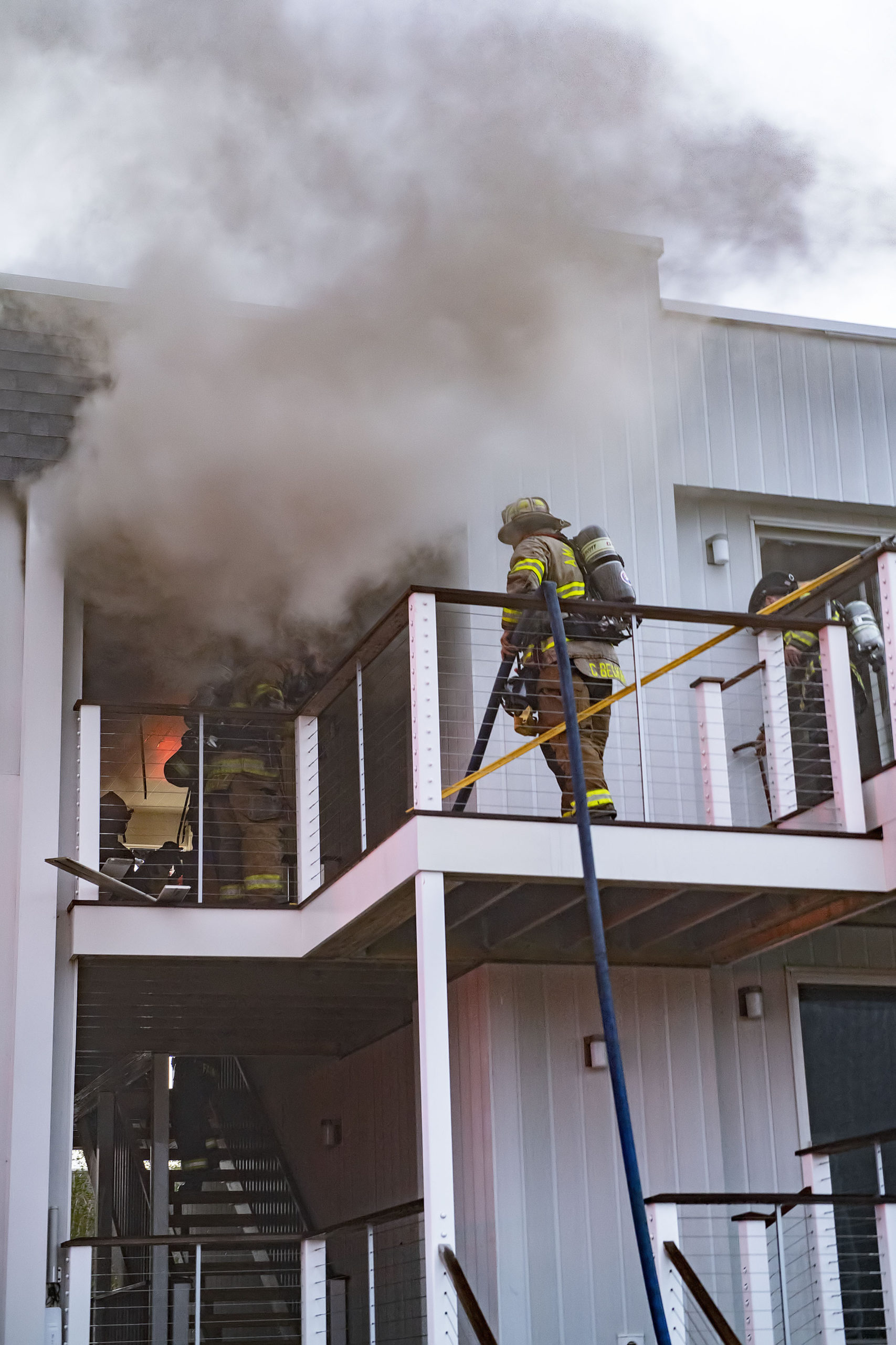 Members of the Montauk, Amagansett and East Hampton Fire Departments battled a working fire at the Atlantic Bluffs Condominiums at 707 Old Montauk Highway on Saturday night.  MICHAEL HELLER