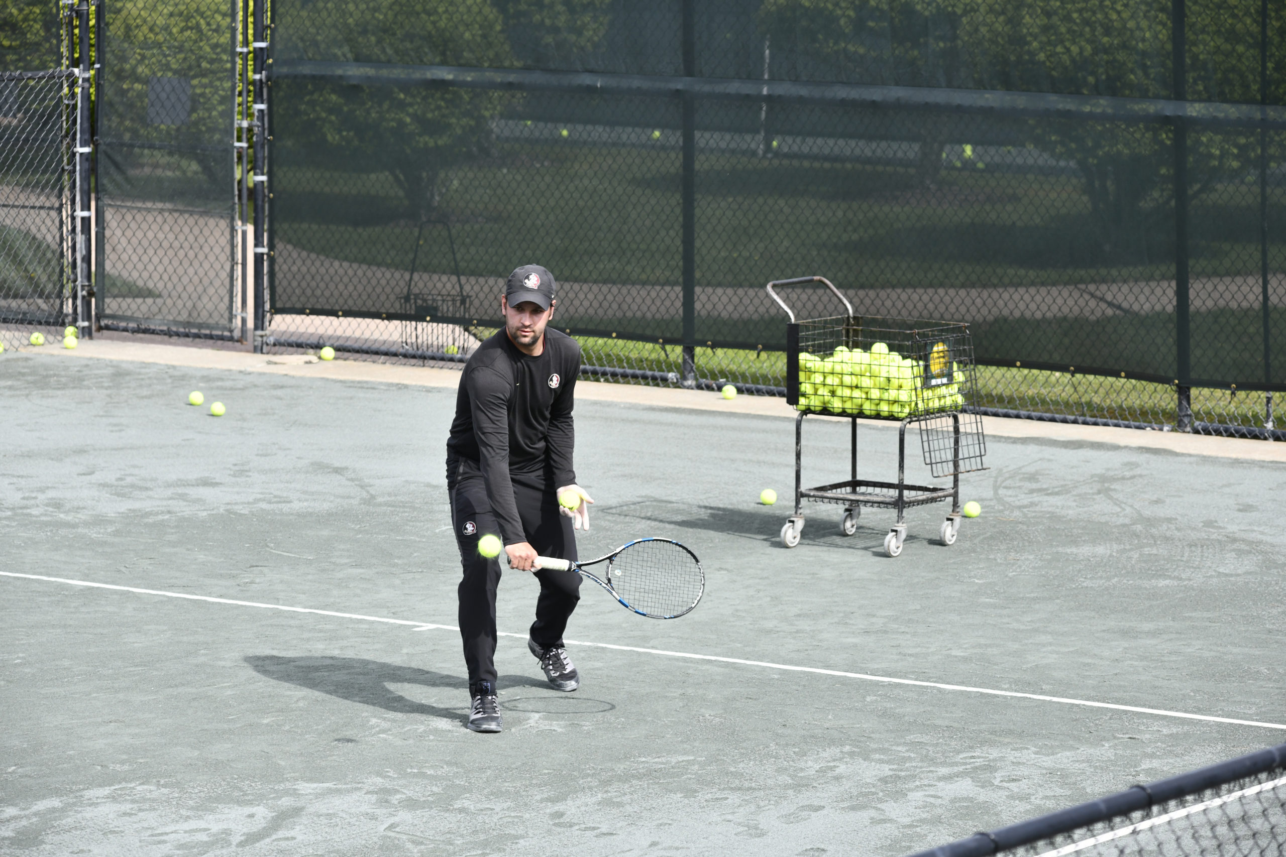Tennis instuctor Matej Zlatkovic works with a student at East Hampton Indoor Tennis on Saturday morning.  DANA SHAW