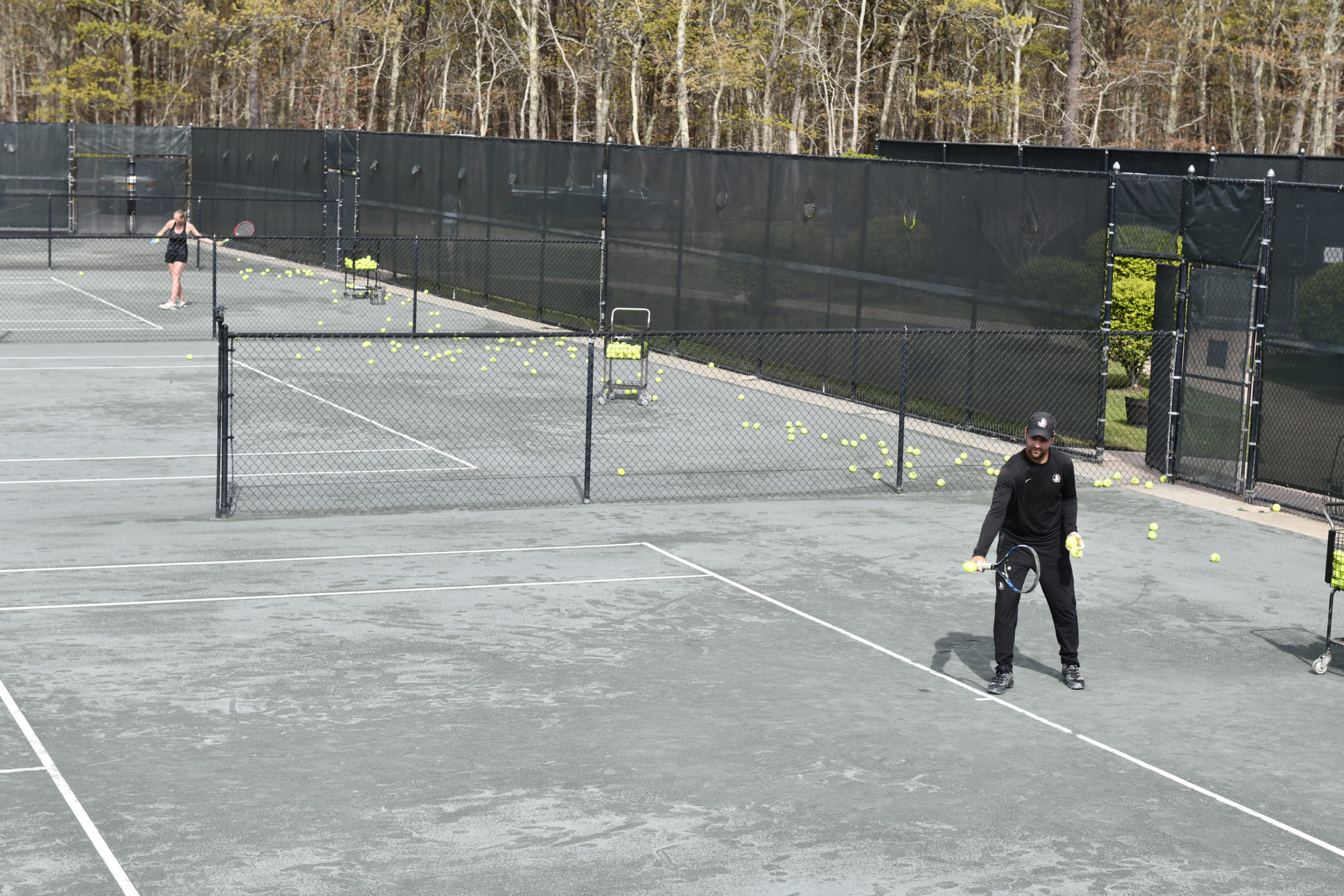 Tennis instuctor Matej Zlatkovic works with a student at East Hampton Indoor Tennis on Saturday morning.  DANA SHAW