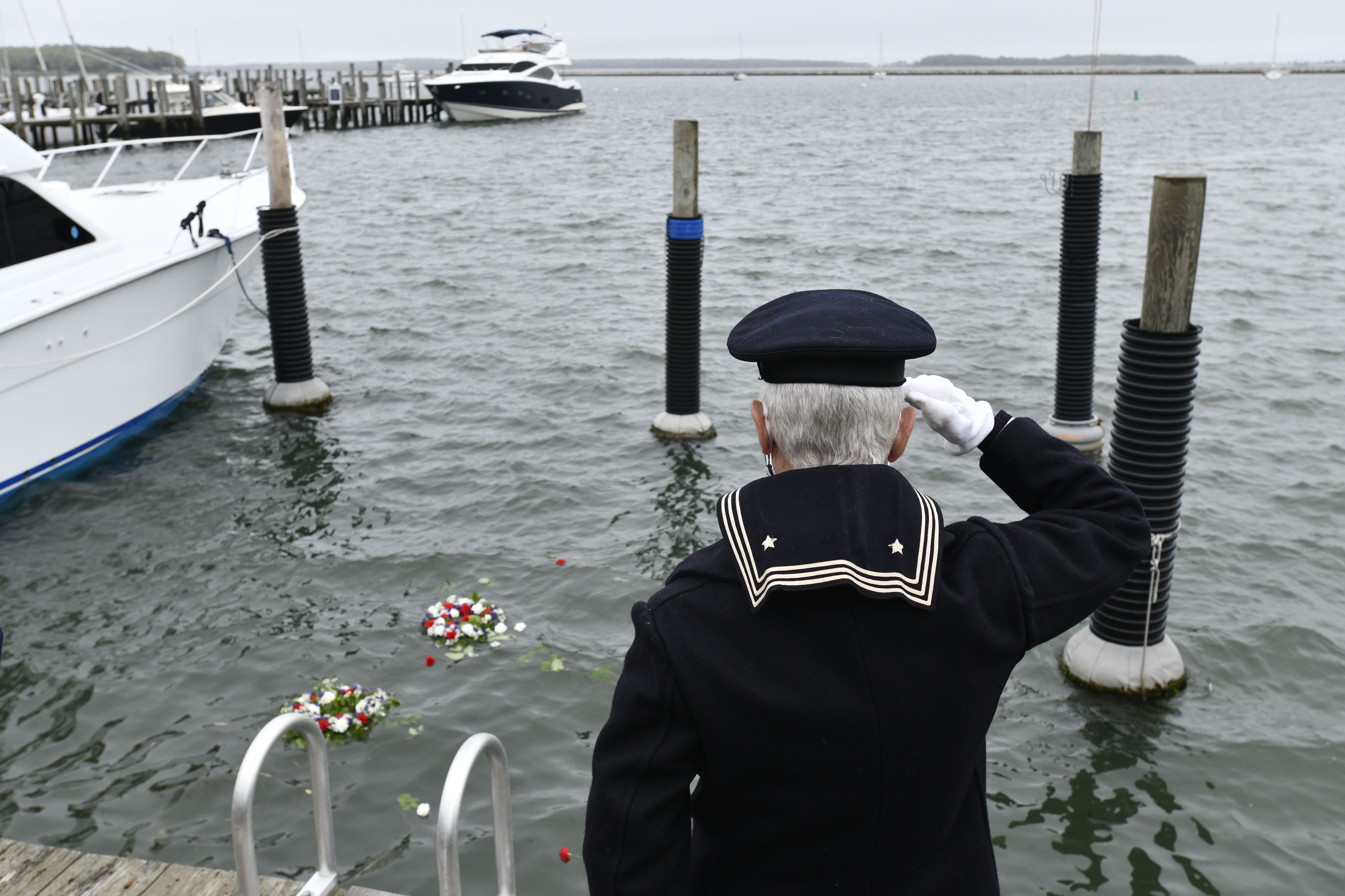 John Capello salutes during Memorial Day observances in Sag Harbor on Monday.