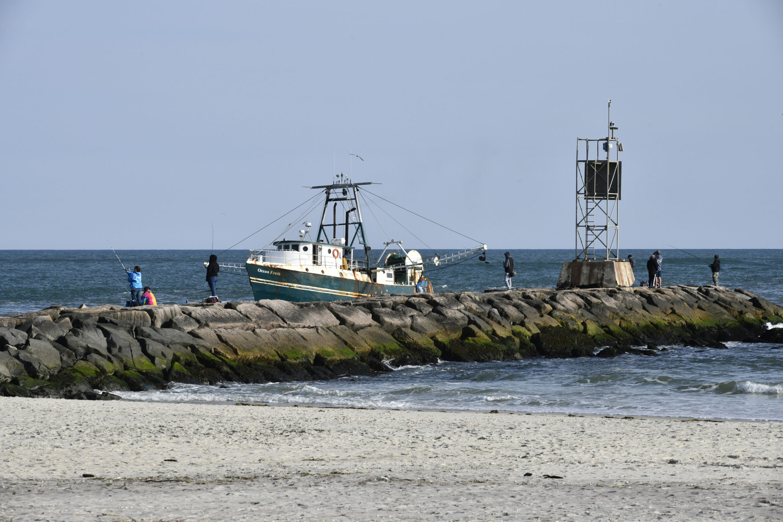Fishermen head into Shinnecock inlet in Hampton Bays.  DANA SHAW