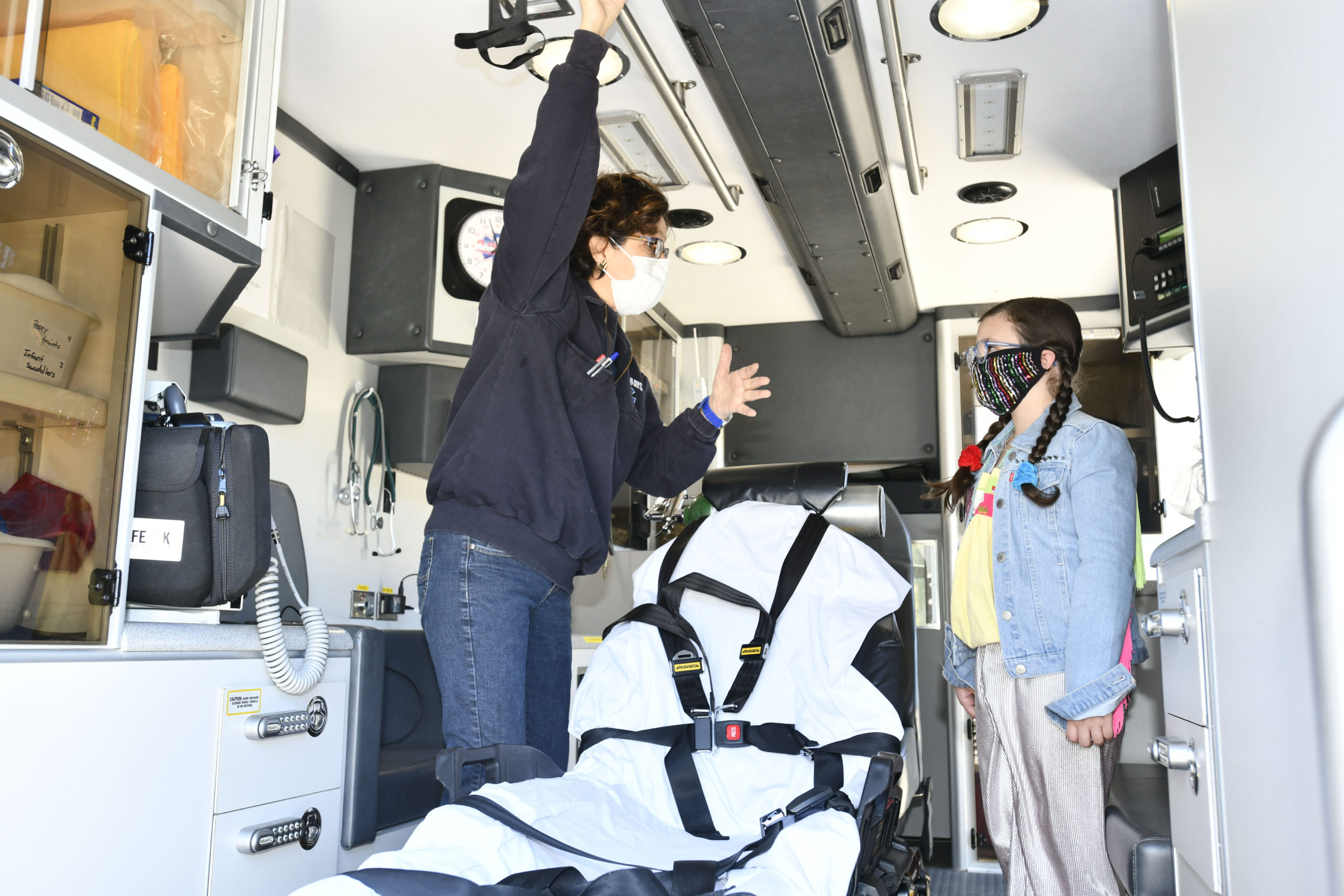 DJ Vivy get a tour of an ambulance.  DANA SHAW