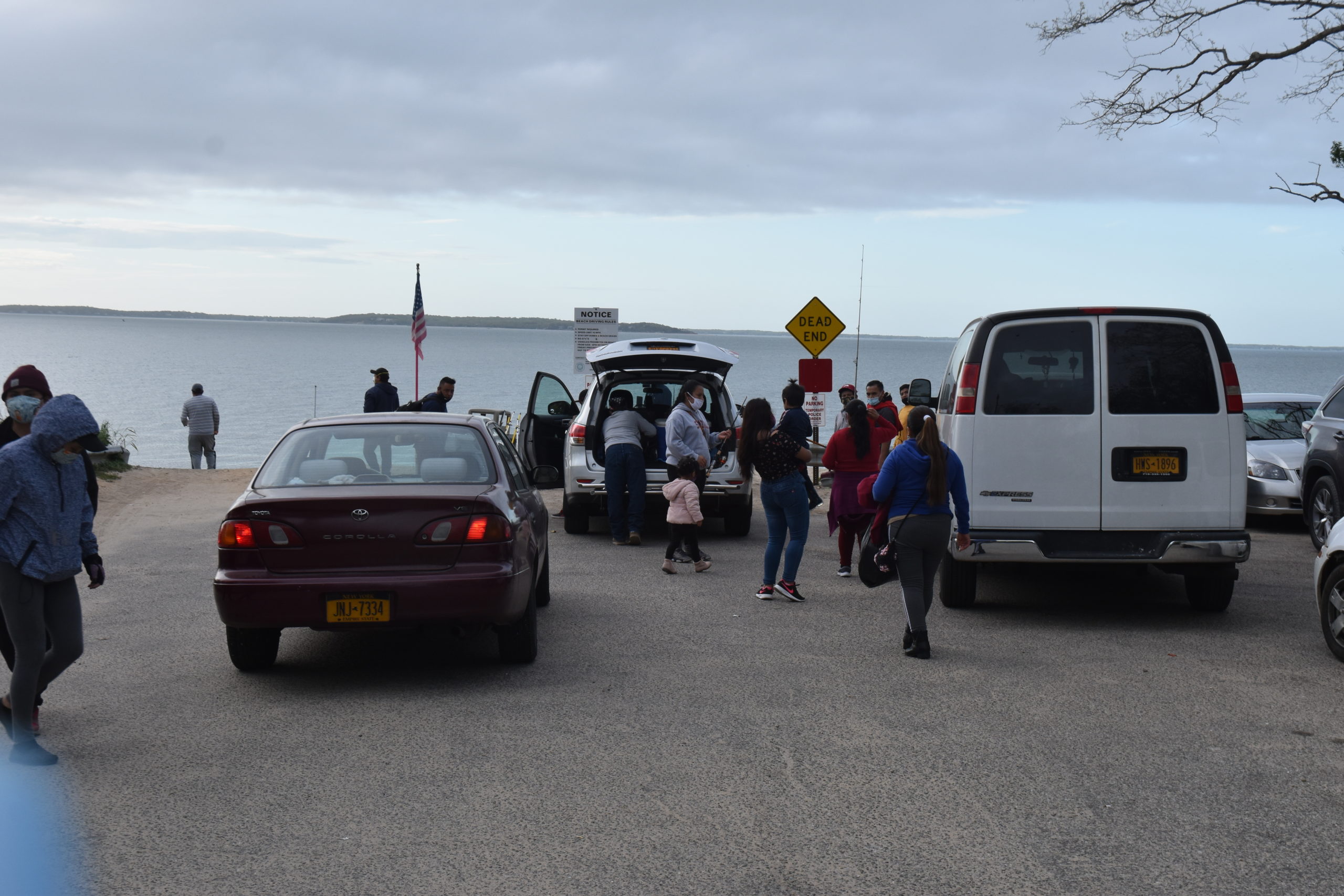 Families, many of whom said they drove out from Queens and Brooklyn, arrive at North Sea Beach Friday night. STEPHEN J. KOTZ