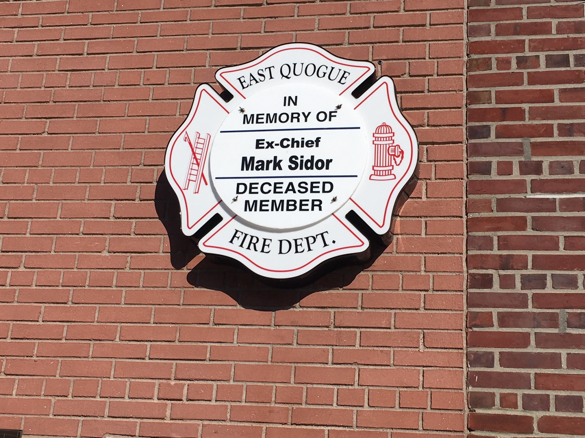 The placque marks Mark Sidor's service with the East Quogue Fire Department.  LORI SIDOR
