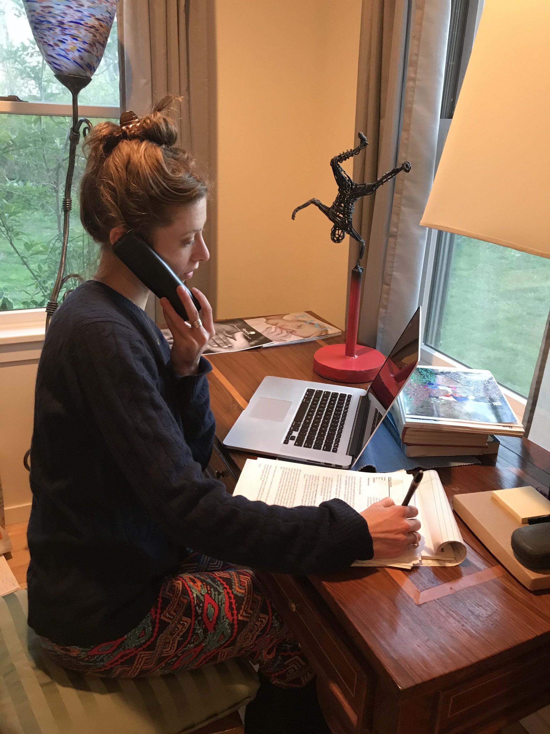 Julia, a volunteer for The Retreat, answers a call on the 24-hour emergency hotline.