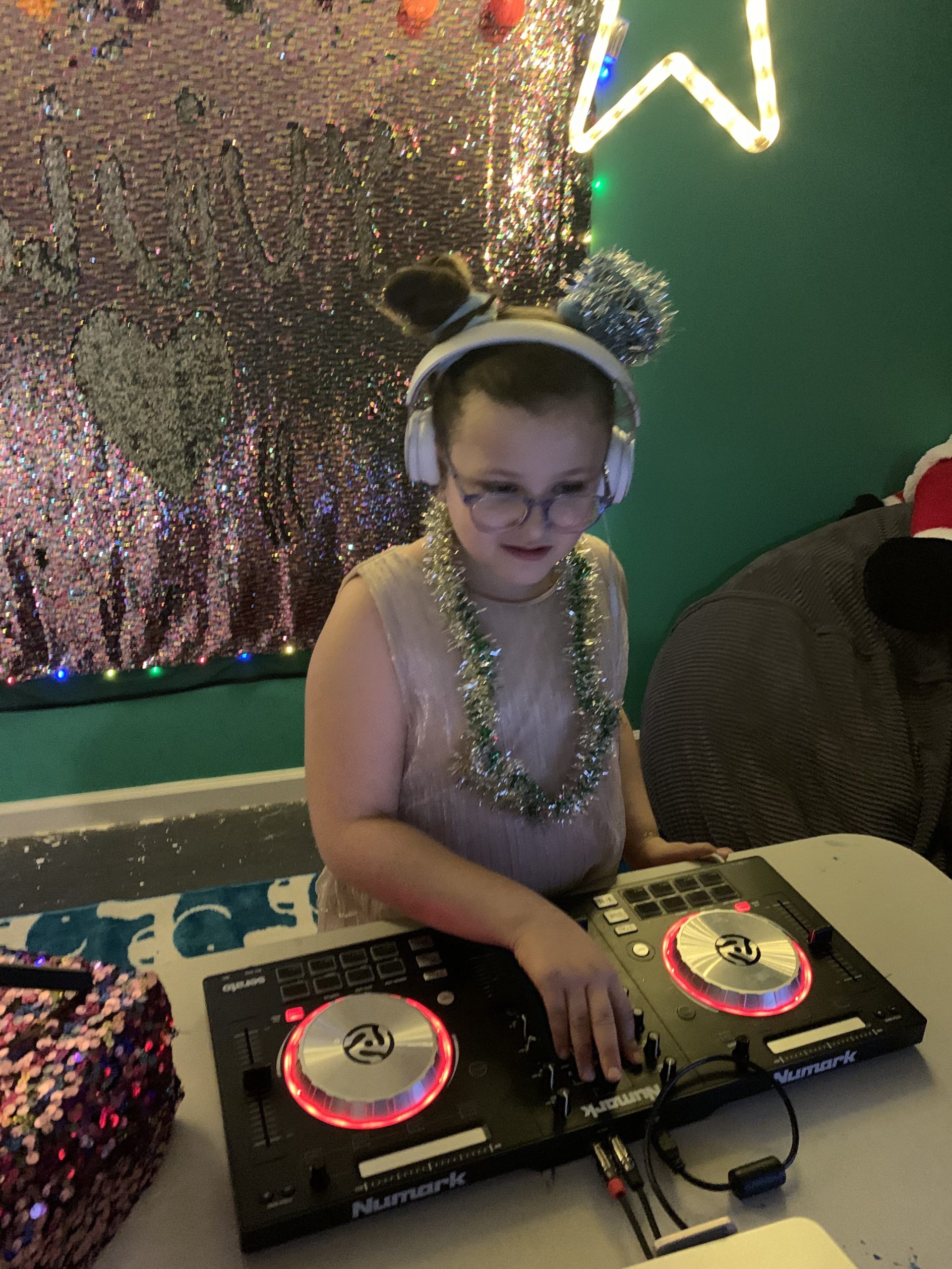 DJ Vivy spinning in her basement at home in Hampton Bays.