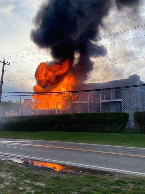 Fire rips through the Atlantic Bluffs complex on Old Montauk Highway in Montauk shortly before fire fighters arrive on the scene Saturday evening. 