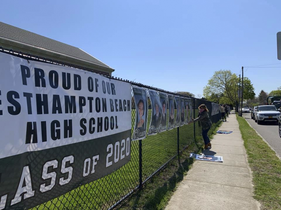 The Westhampton Beach High School Class of 2020 is being recognized with giant posters that adorn the fence along Mill Road in Westhampton Beach.  COURTESY WESTHAMPTON BEACH SCHOOL DISTRICT