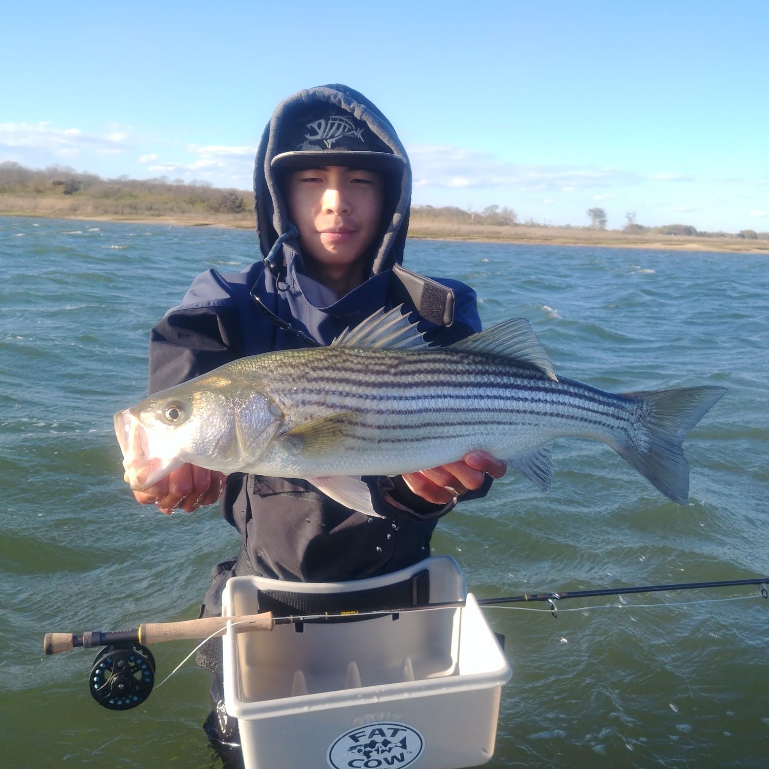 Jacky Long with a nice striped bass on fly caught in Shinnecock Bay recently. 