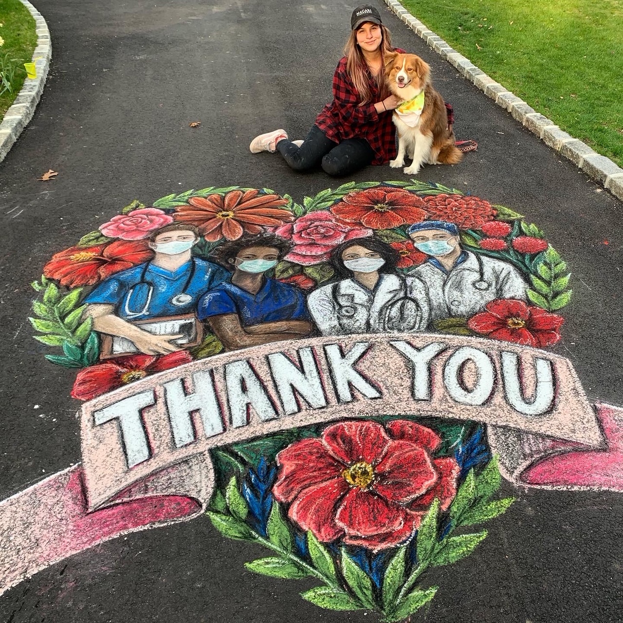 Chalk artist Kara Hoblin with her dog, Lily, and the driveway tribute to healthcare workers that went viral.