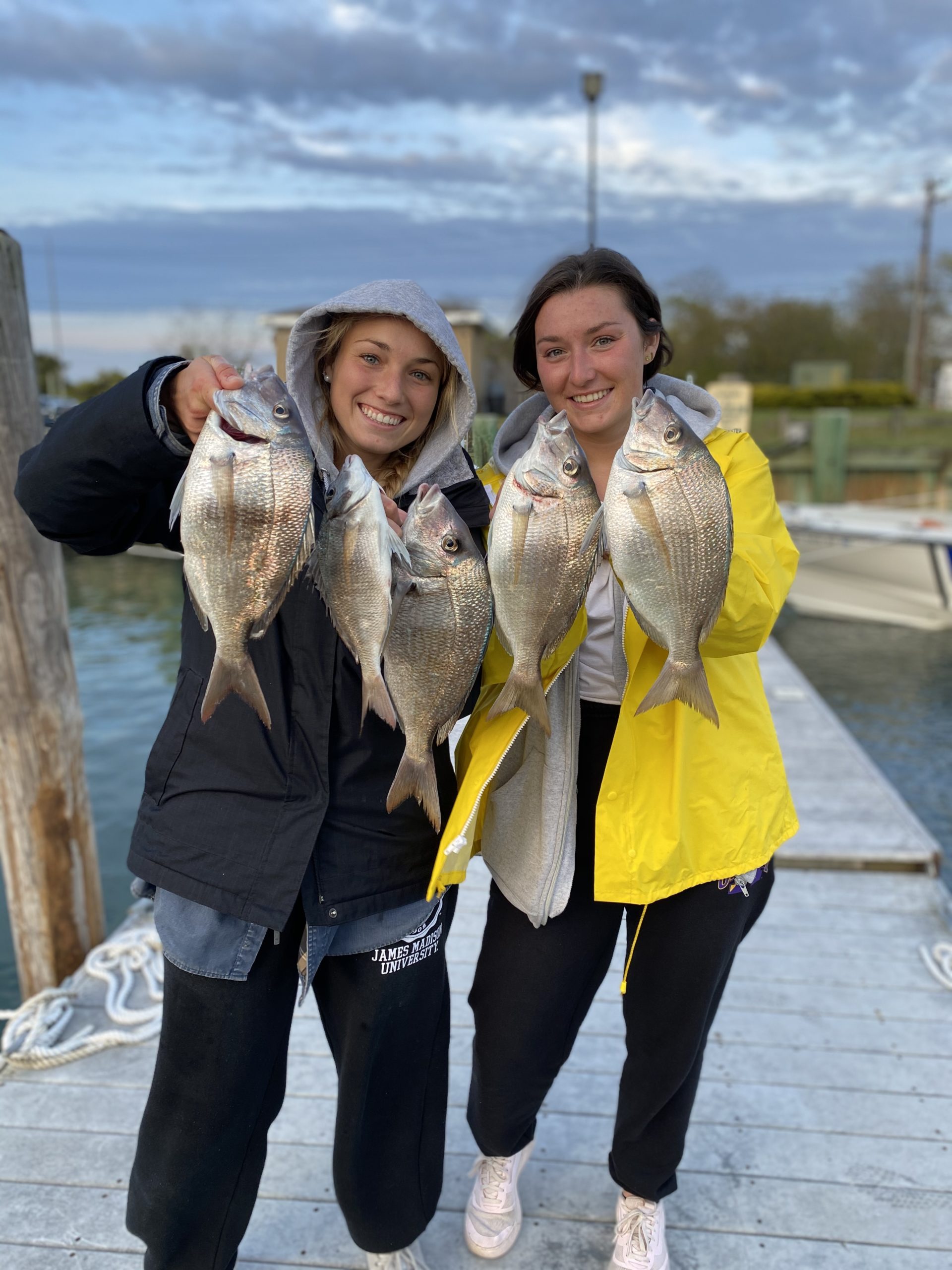 The Zaweski twins, Laura and Drew, from Hampton Bays filled buckets with jumbo porgies while fishing with their dad in the Peconics recently. 