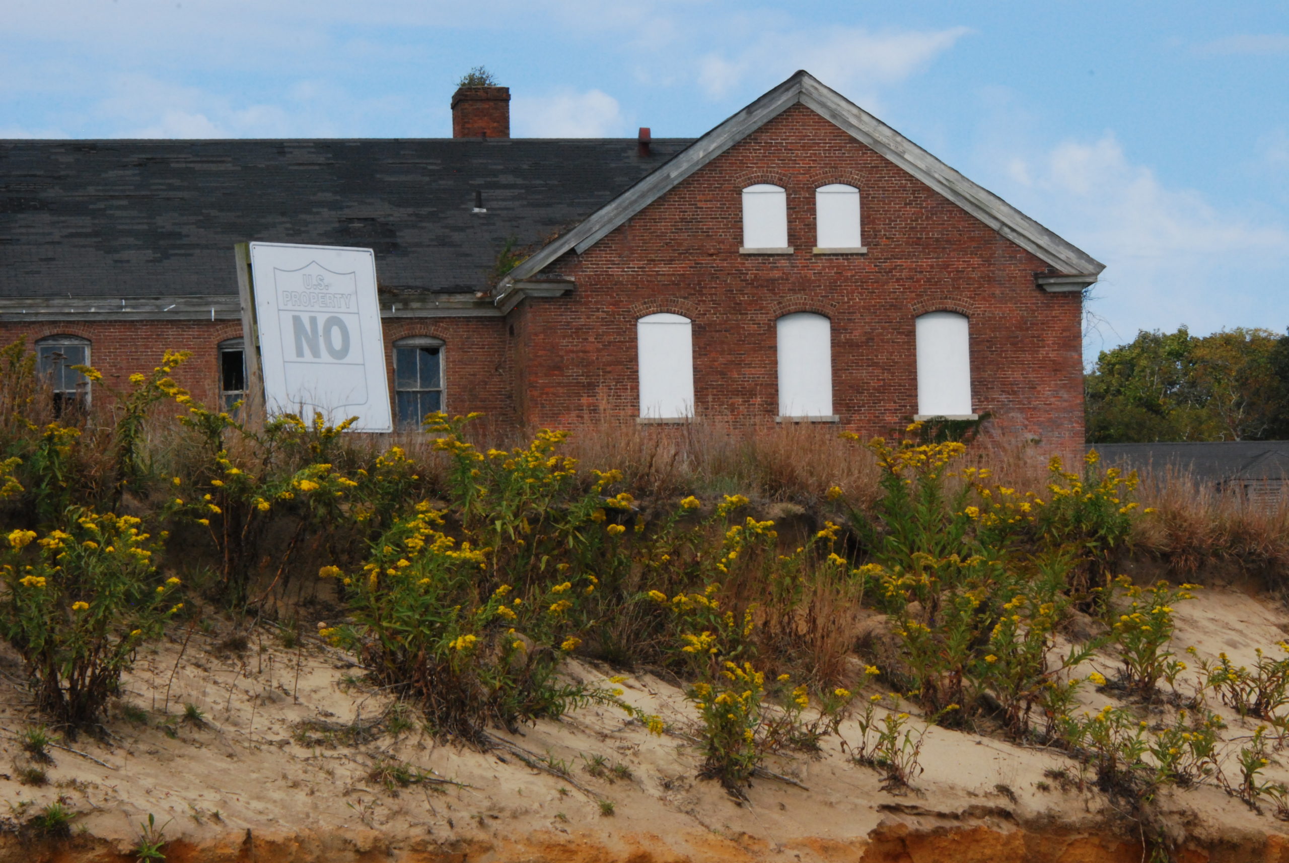 The largest of the barracks (#55, with 218 beds) on Plum Island viewed from the beach on 2017.