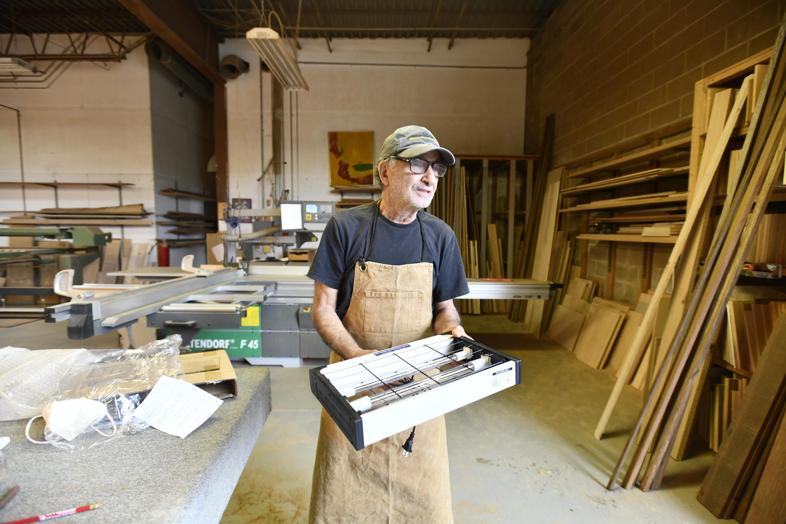 Shimon Peretz in his shop on Mariner Drive in Southampton.  DANA SHAW