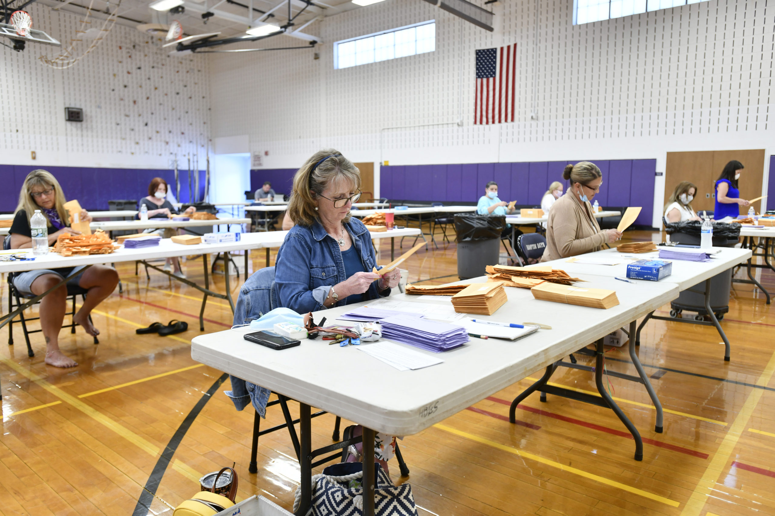 Ballots are opened and counted at Hampton Bays High School on Tuesday.  DANA SHAW