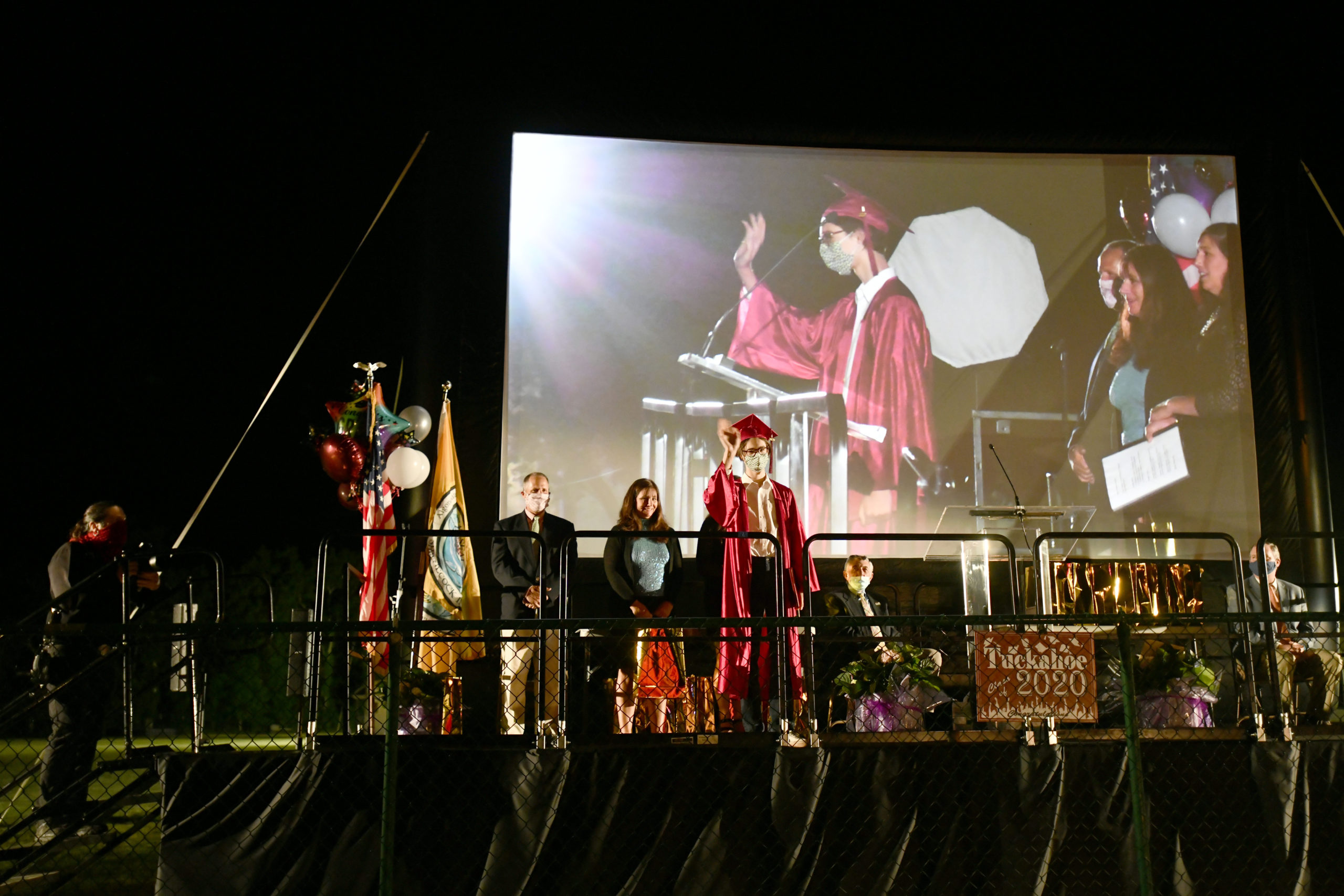 Tuckahoe School celebrated its eighth-grade commencement with a drive-in graduation on Thurdsay night. Parents stayed in their cars while students went on stage to accept their diplomas.  DANA SHAW