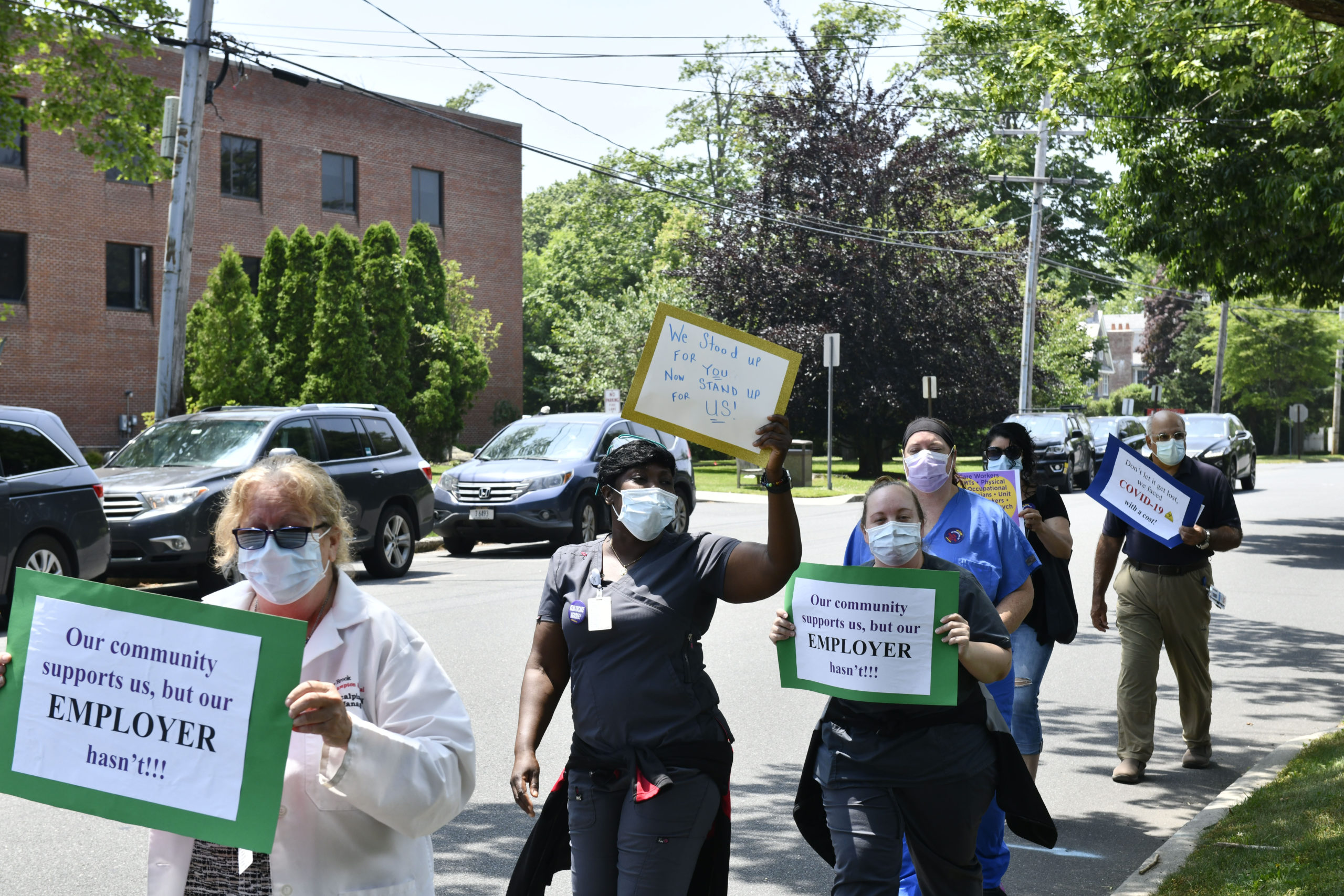 Healthcare workers picket outside of Stony Brook Southampton Hospital on Wednesday afternoon. DANA SHAW