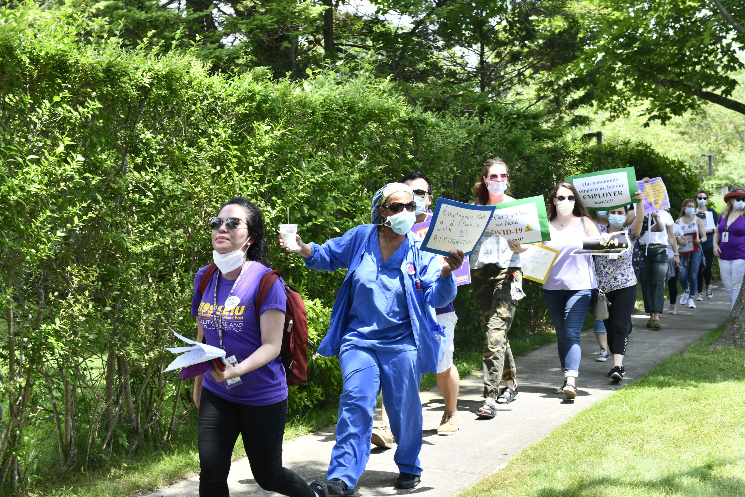 Healthcare workers picket outside of Stony Brook Southampton Hospital on Wednesday afternoon.  DANA SHAW