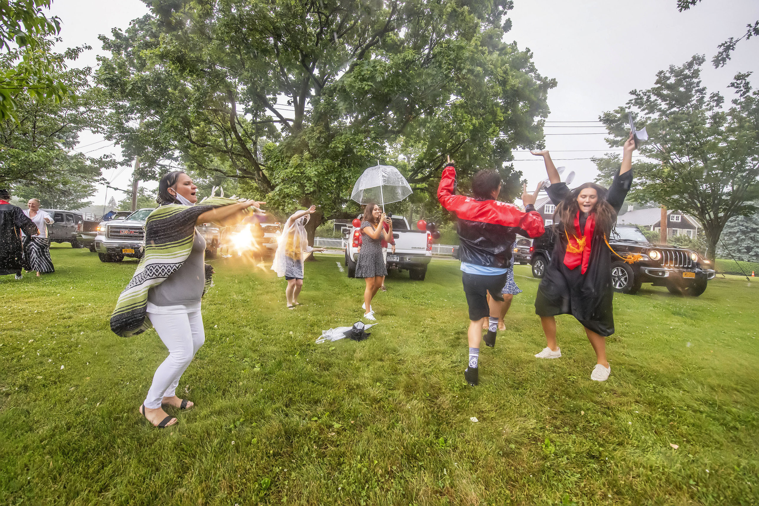 The Nill family dances for joy in the rain after daughter Haley - at far right- graduated in the Pierson High School 2020 Commencement Ceremony at Pierson High School on Saturday.