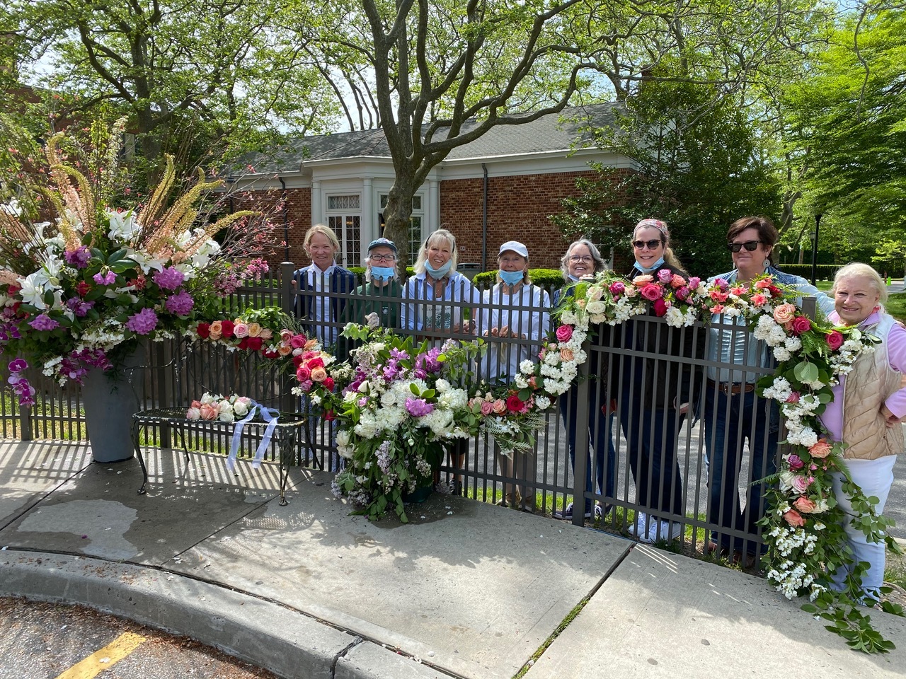 Members of The Southampton Garden, left to right: Deb dela Gueronneire, Lydia Wallis, Cindy Willis, Christl Meszkat, Janis Murphy, Barbara Glatt, Erin Meaney, Elizabeth Robertson, created a surprise ‘Flower Flash’ on the grounds of Stony Brook Southampton Hospital earlier this month to thank staff and employees for all they do for our community. Using flowers from local flower shop Topiare and member’s own gardens, the display was conceived and executed under the direction of club president Barbara Glatt and members Erin Hattrick Meaney and Cindy Willis.