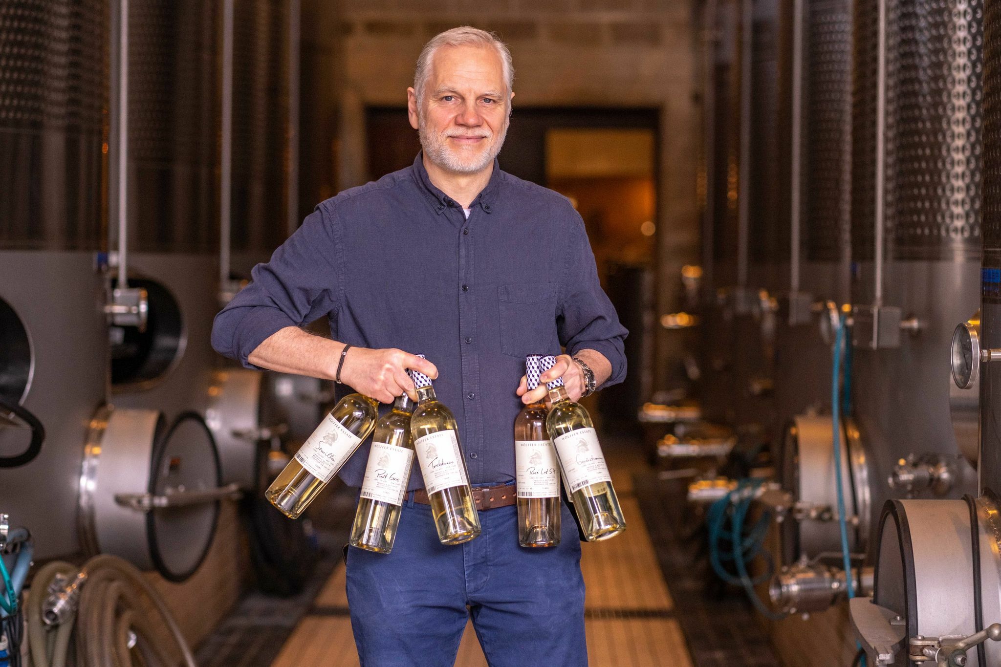 Wölffer Estate Vineyard's winemaker Roman Roth with the Cellar Series collection of small batch releases of artisanal wines.