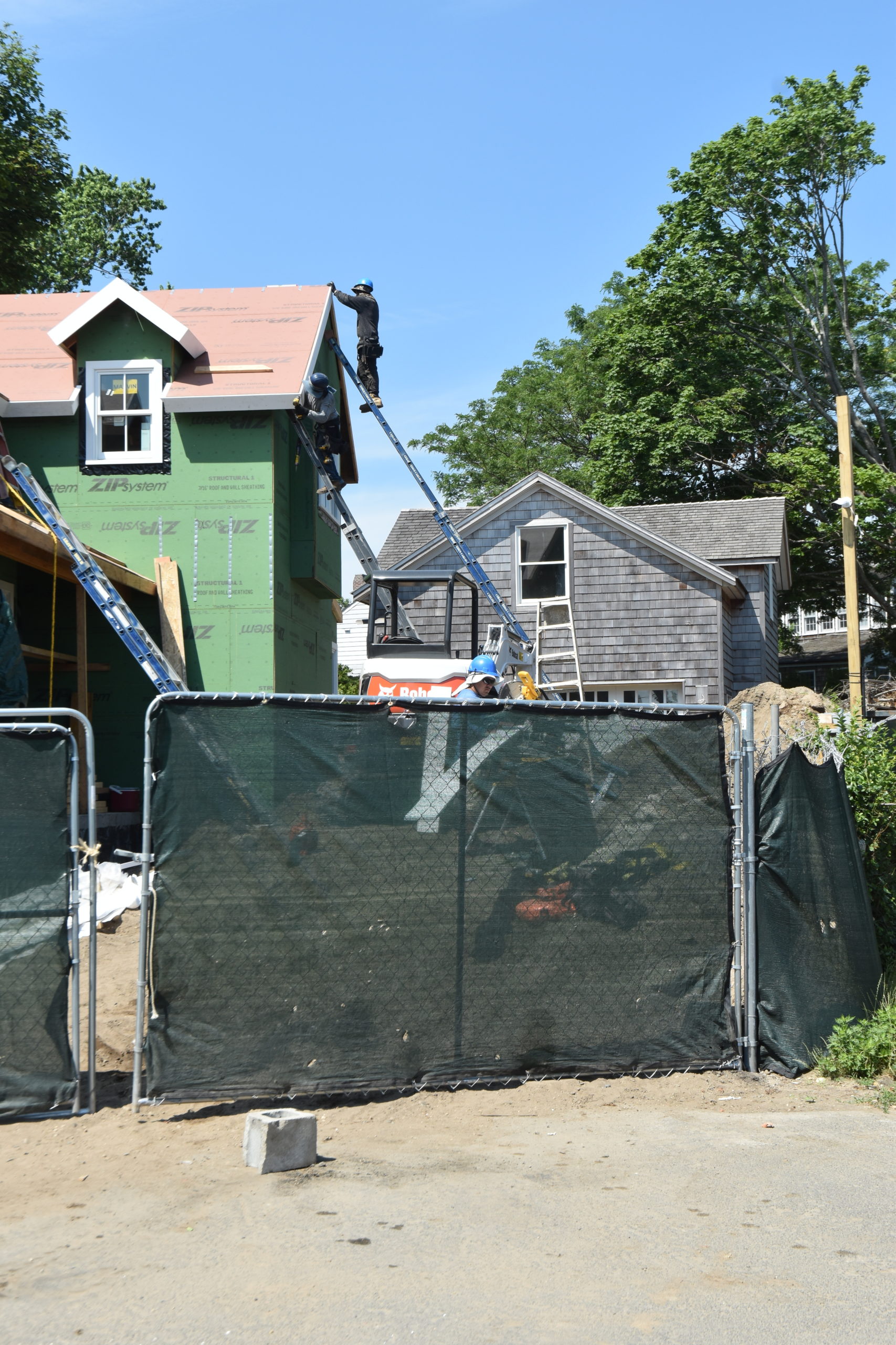 A worker at 24 Rysam Street in Sag Harbor before the village obtained a restraining order forcing a suspension of construction at the site. STEPHEN J. KOTZ