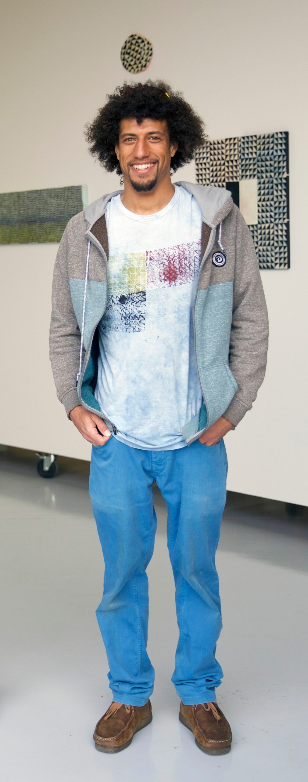 Tripoli Patterson in front of the Sabra Moon Elliot exhbition at Tripoli Galley, June 2020. 