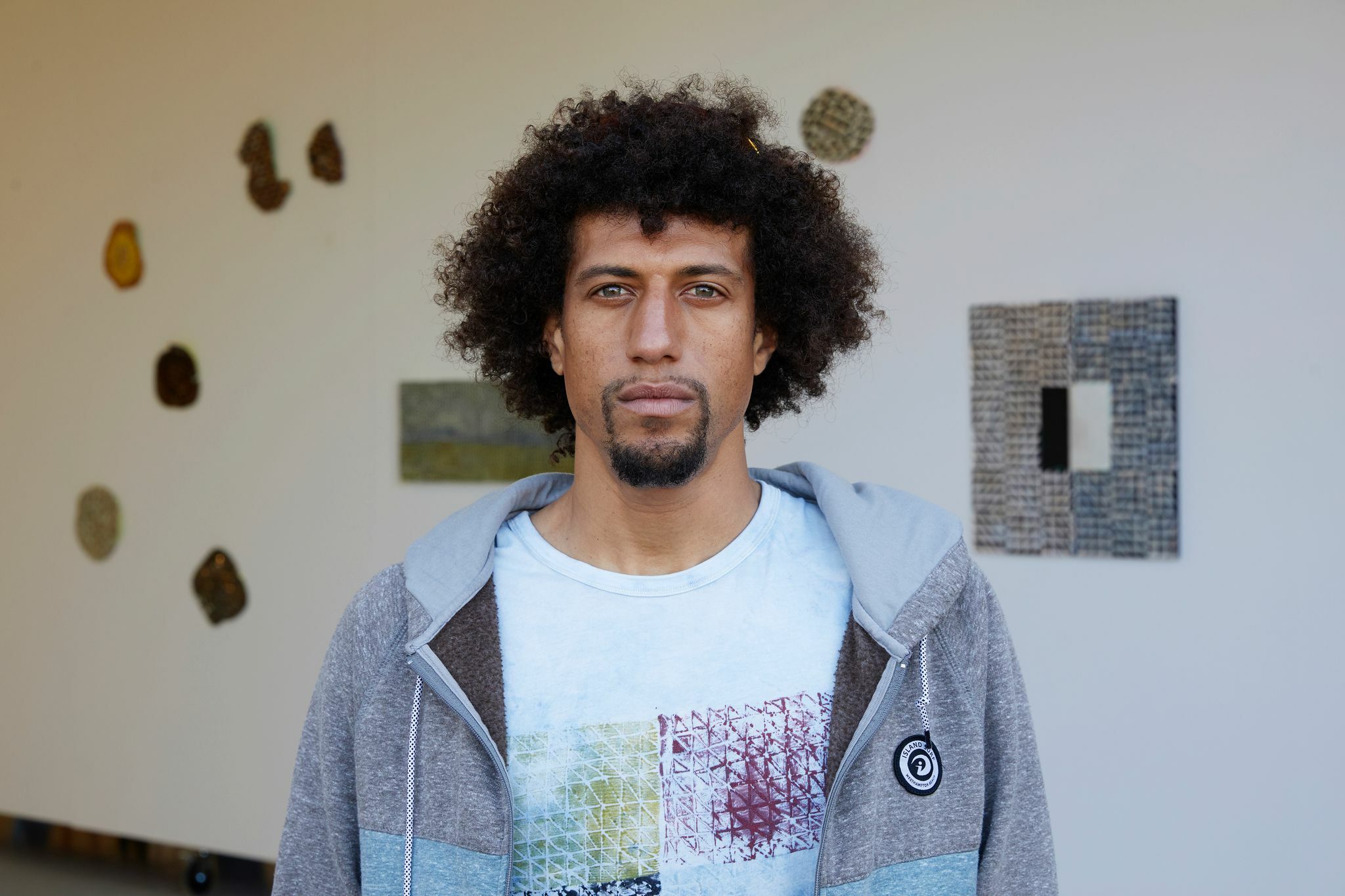 Tripoli Patterson In front of the Sabra Moon Elliot exhibition at Tripoli Gallery, June 2020.