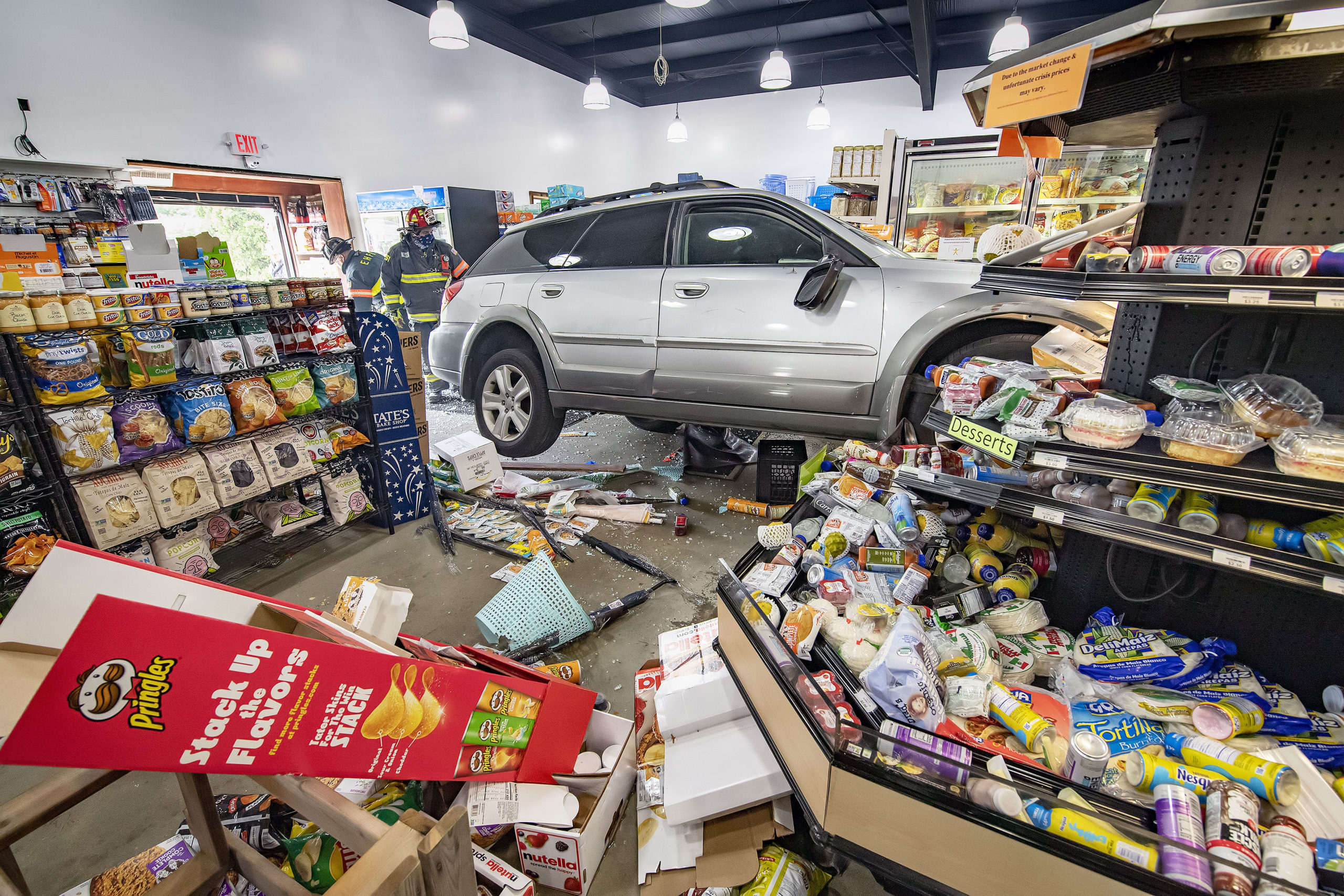 Two people suffered minor injuries when an car smashed through the front of the East Hampton Market on Race Lane. 