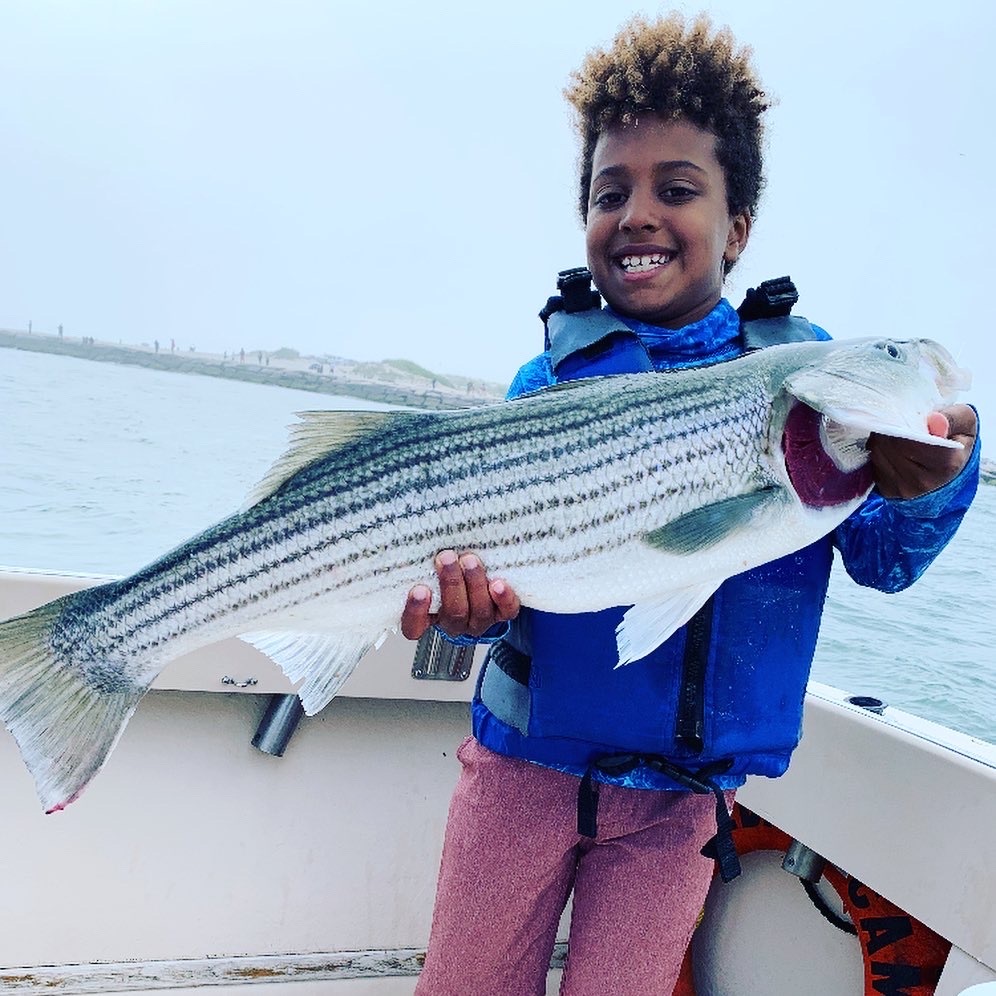Auggie Baker decked this nice slot keeper striped bass while fishing in Shinnecock Inlet with Capt. Brad Ries of Someday Came Charters last week. 