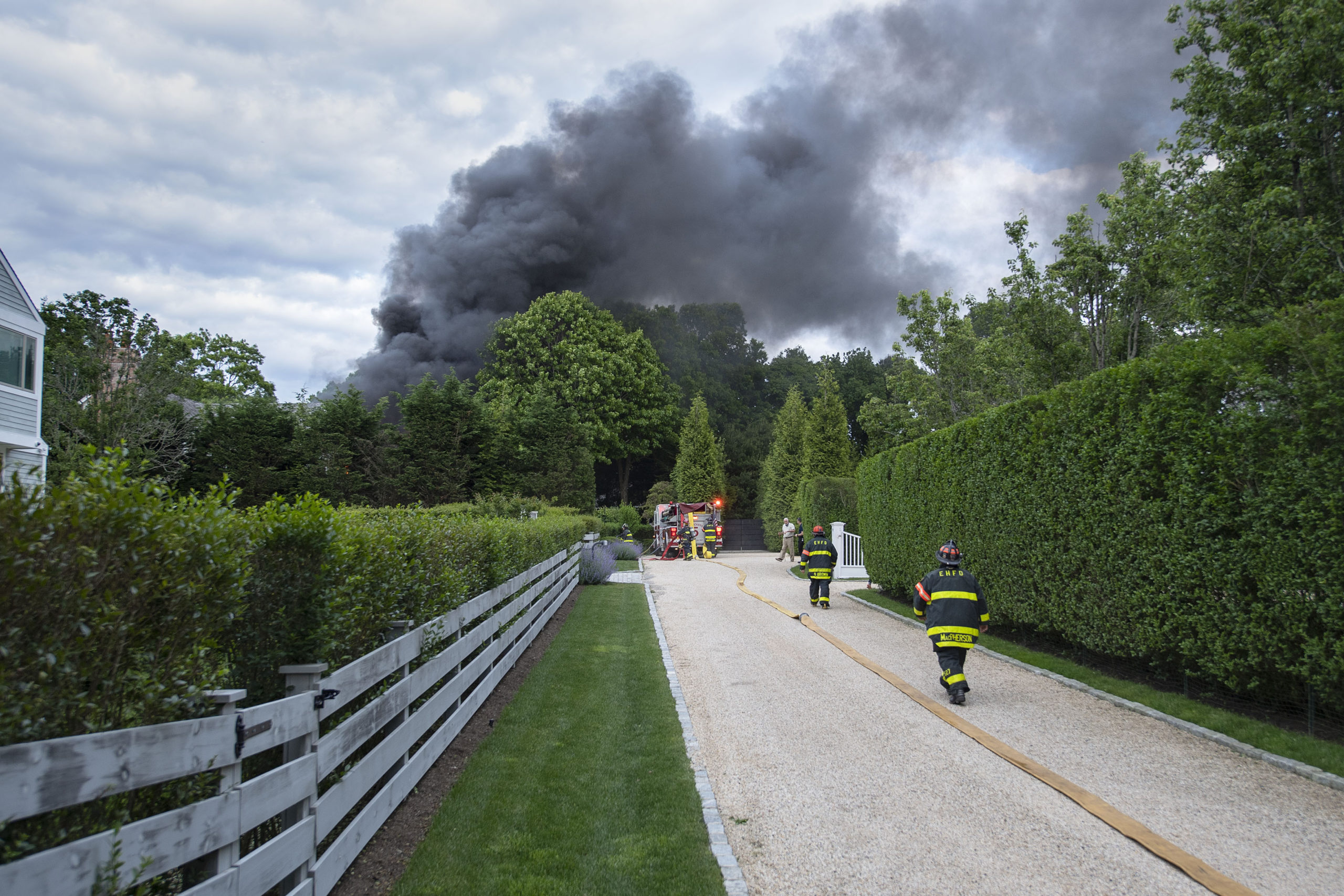 East Hampton Fire Department volunteers contained a garage fire on Sunday afternoon before it spread to the rest of a Roberts Lane home. 