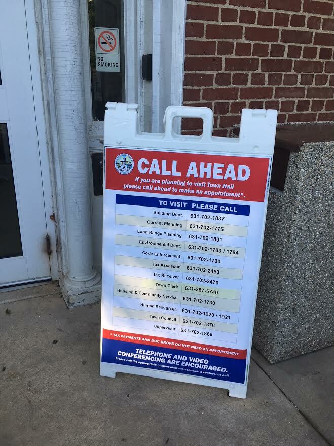 Vistors are given safety directions at the entrance to Southampton Town Hall. KITTY MERRILL