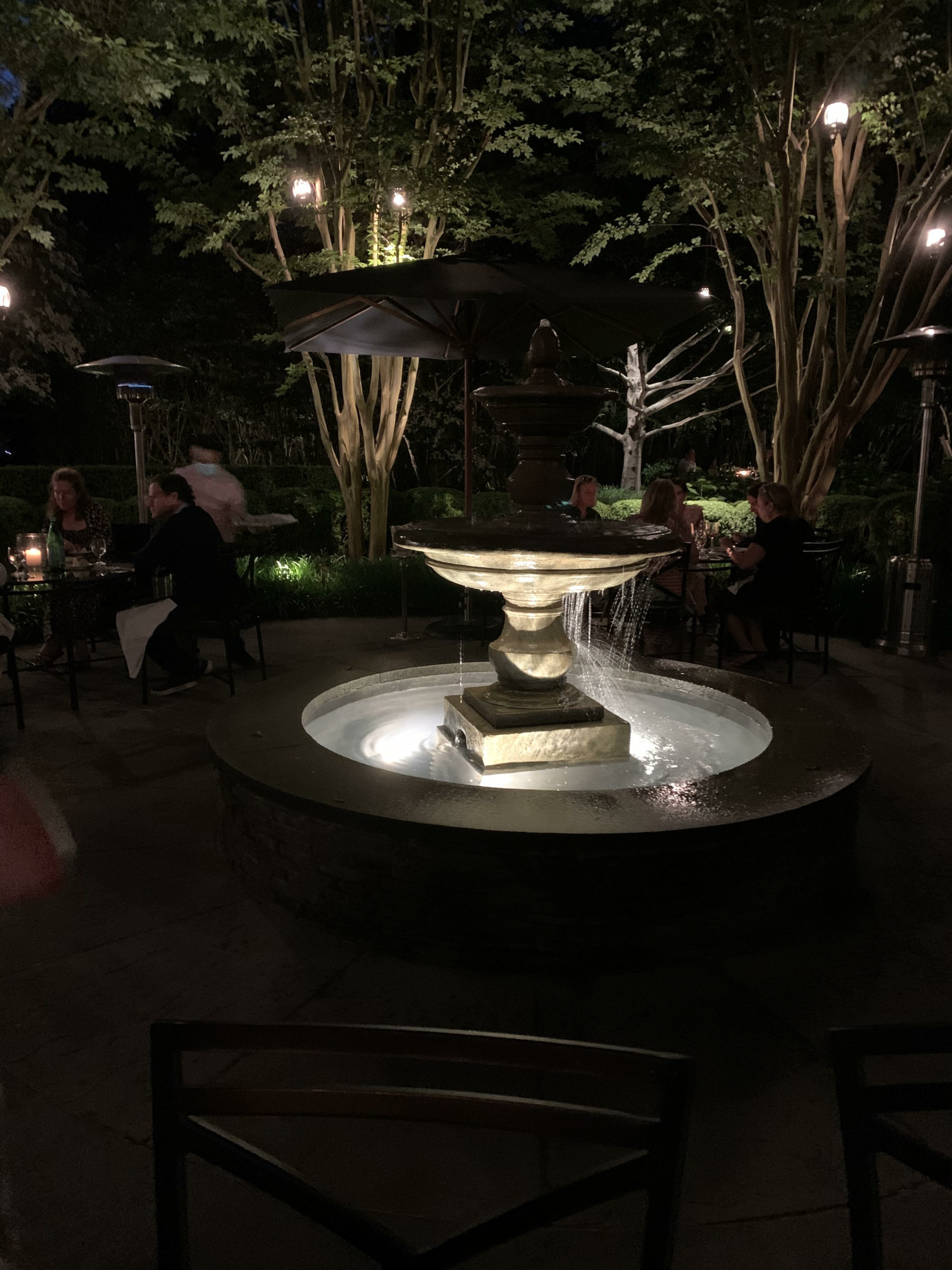 The centerpiece fountain lights the patio after dark at The 1770 House. 