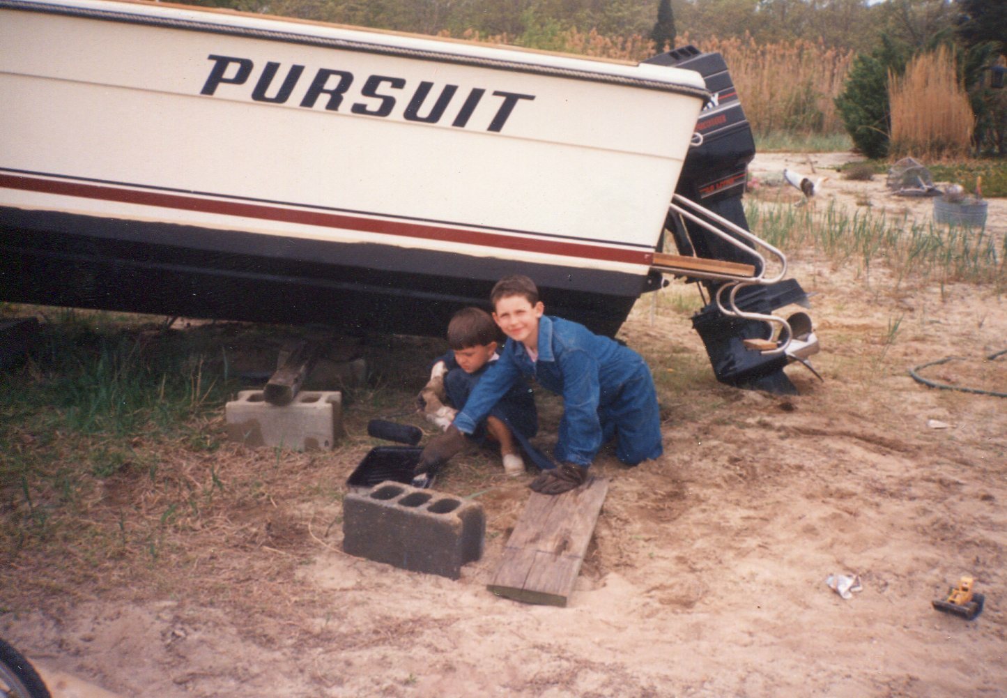 1992_ Ryan Strong with cousin Kyle work on Grandpa Dave Strong's Pursuit Summer Fun