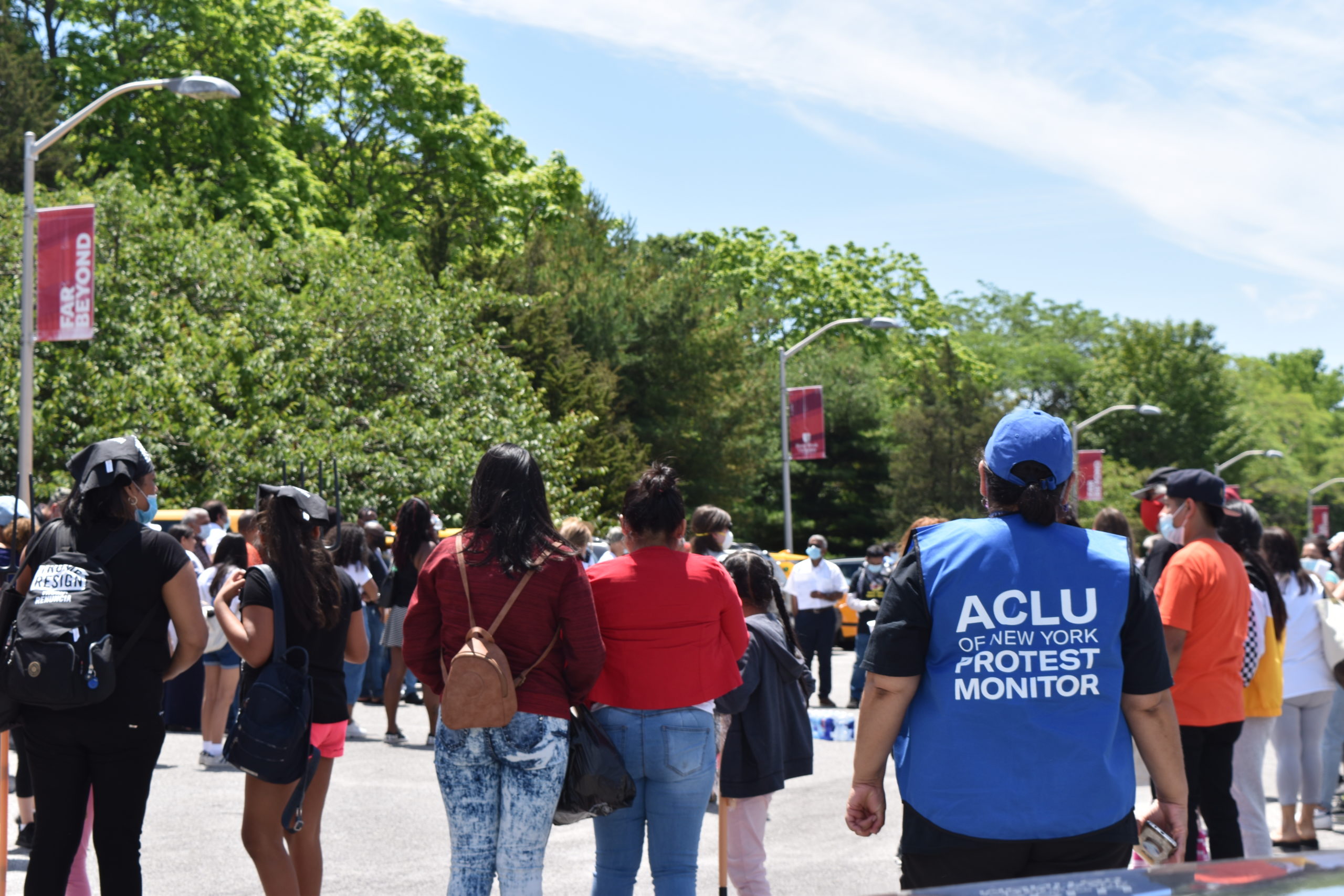Before traveling to former New York City Mayor Michael Bloomberg's home, protesters in the caravan gathered in the parking lot of Stony Brook University's Southampton campus. 