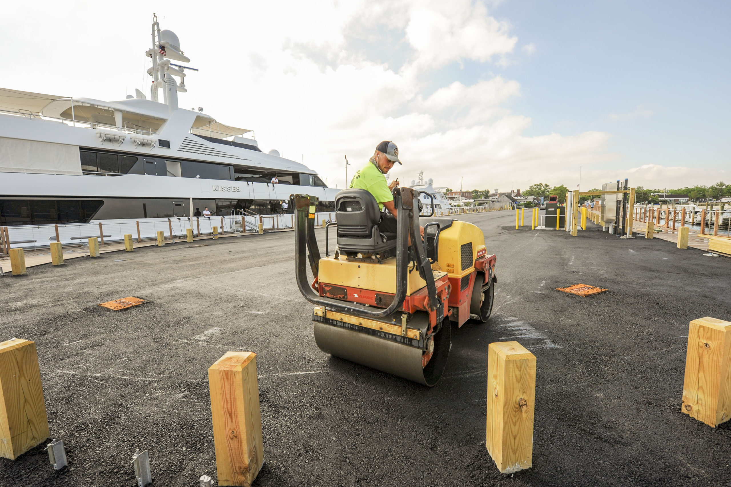 Workers were busy paving Long Wharf in Sag Harbor in anticipation of its reopening in time for the July 4 weekend. MICHAEL HELLER