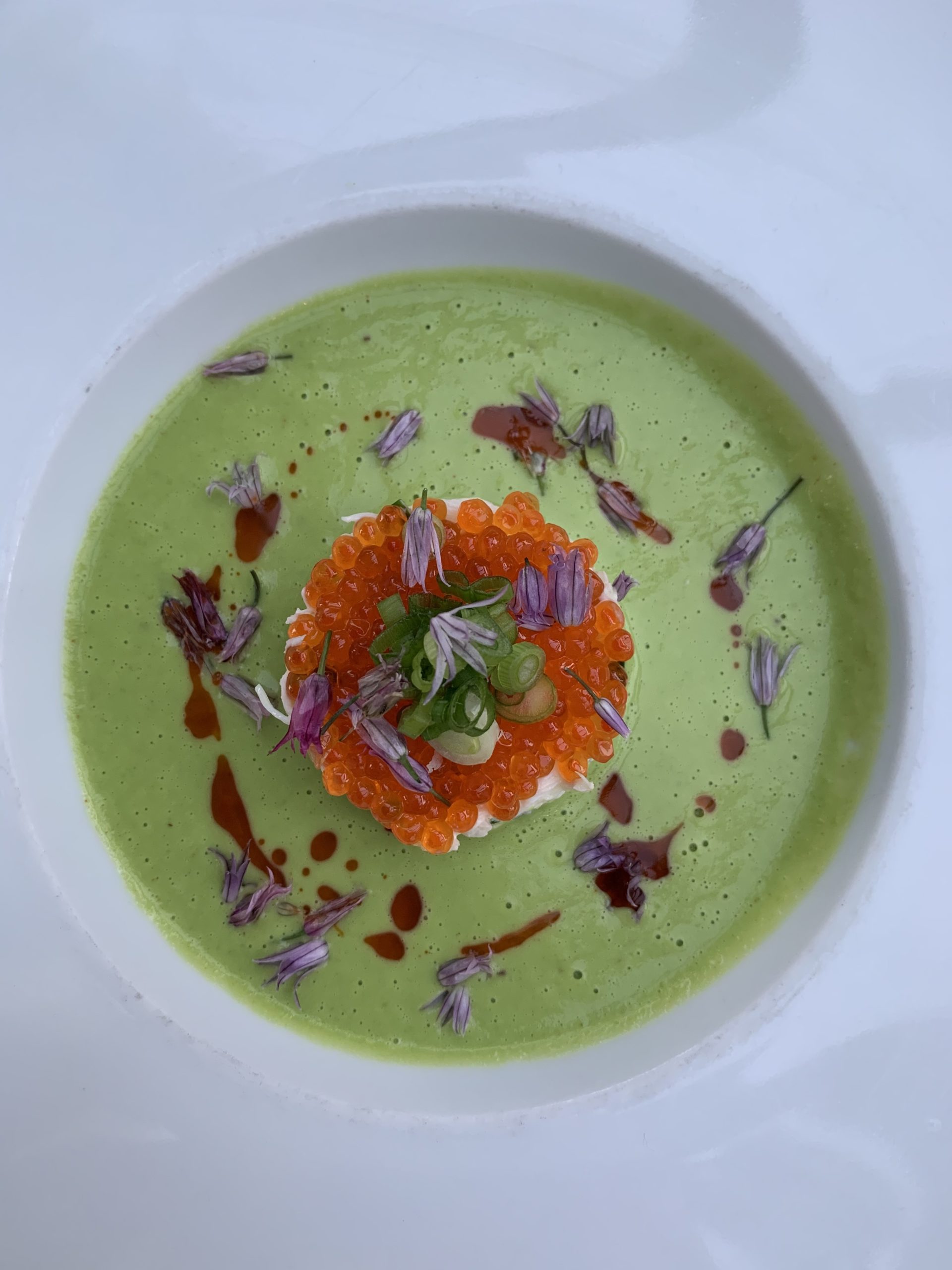 A chilled sweet pea soup topped with a cold crab salad, paprika oil and smoked trout roe is one of the first course offerings on the new prix fixe. 