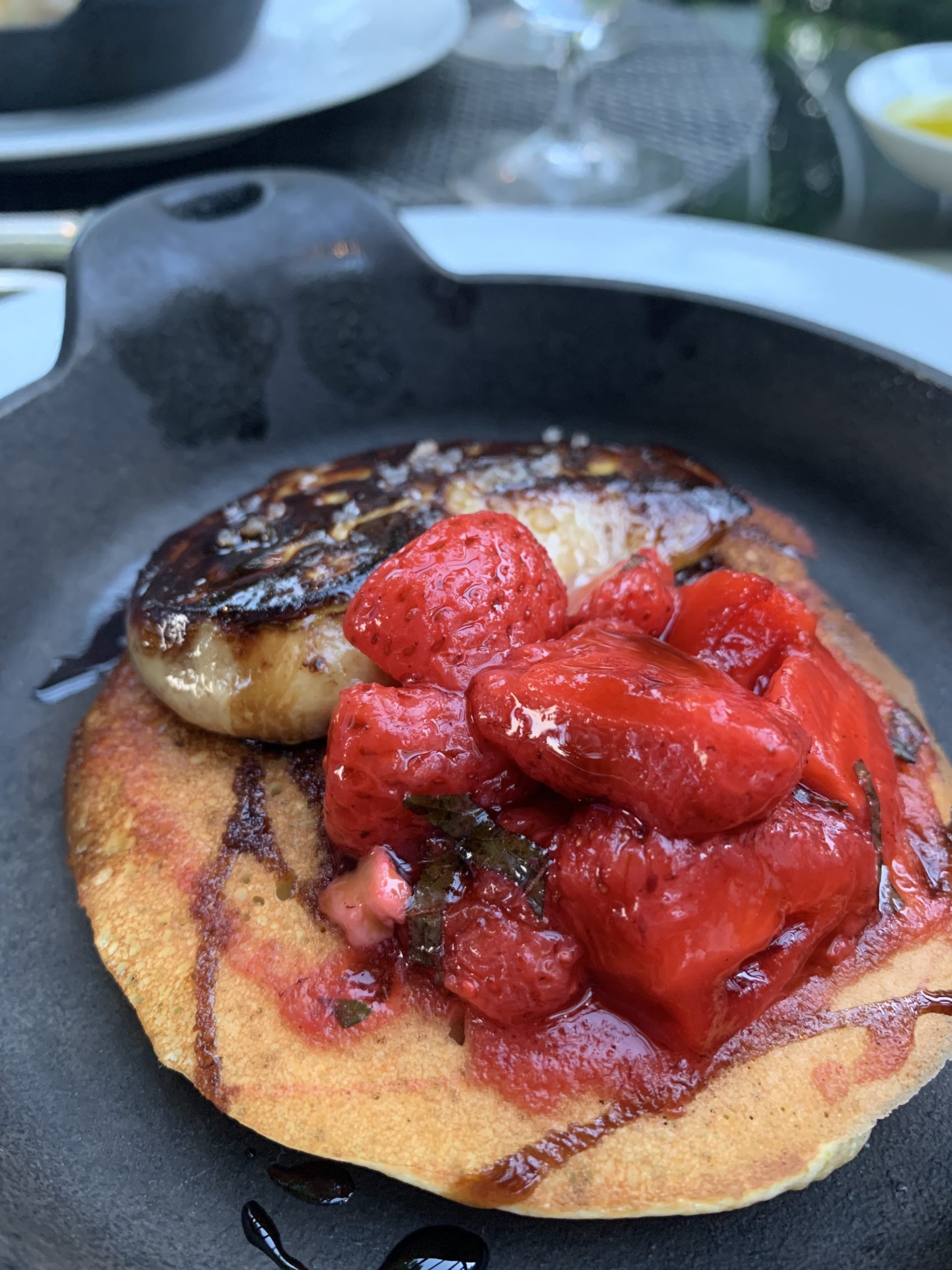 Seared Hudson Valley foie gras with local Sagg Main strawberries, Shiso and Vincotto sits atop a buttermilk pancake. 
