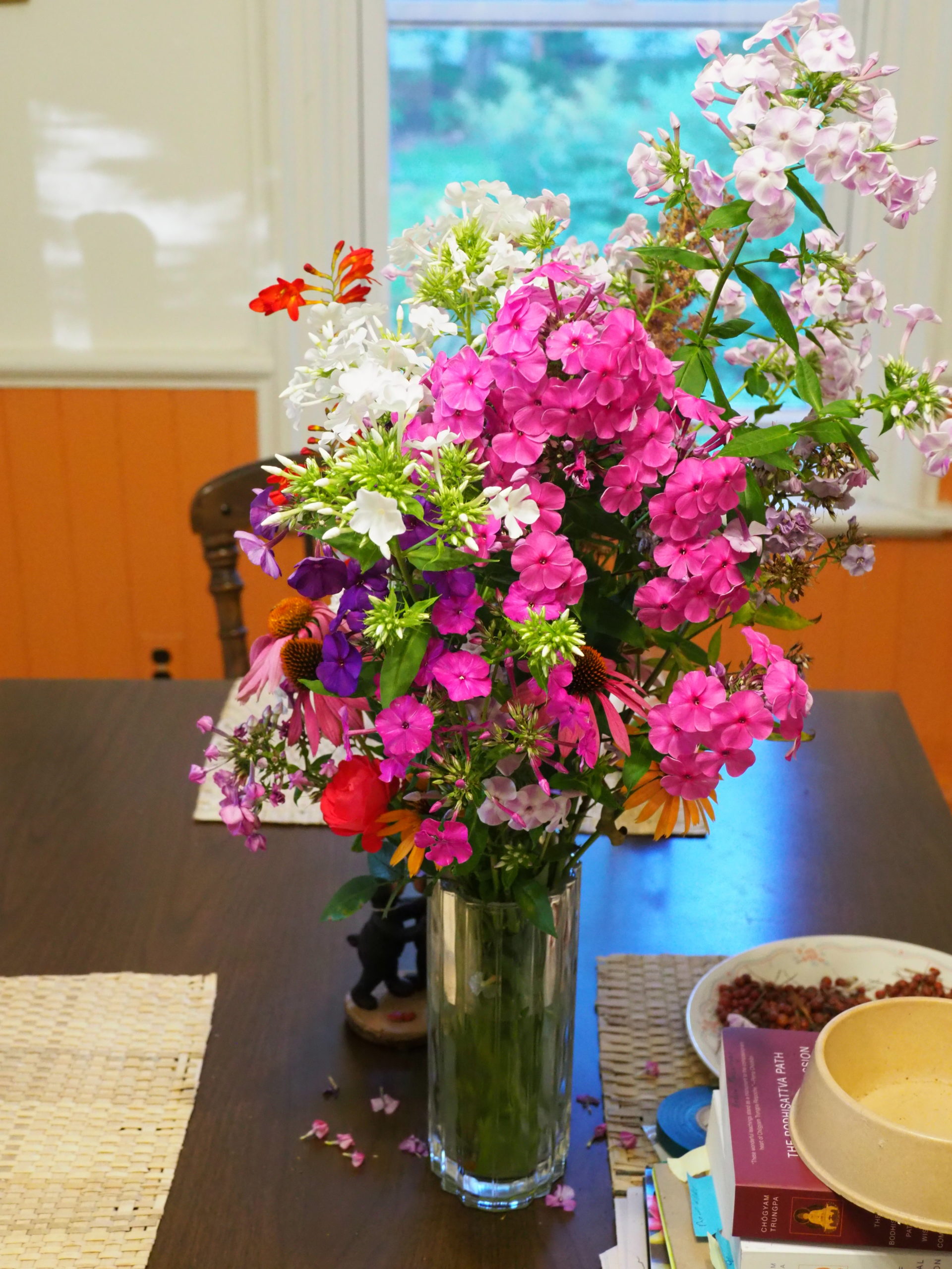 Cut flowers are always on the Hampton Gardener's kitchen table from April through November. This August vase contains six varieties of tall garden Phlox (Phlox paniculate) with a stem of Crocosmia and a few brown-eyed daisies.
