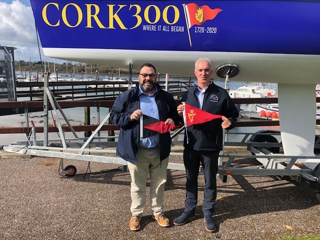 Admiral Colin R. Morehead of the Royal Cork Yacht Club swapping burgees with J.M. Sheehan, commodore of the Westhampton Yacht Squadron, in March 2020.