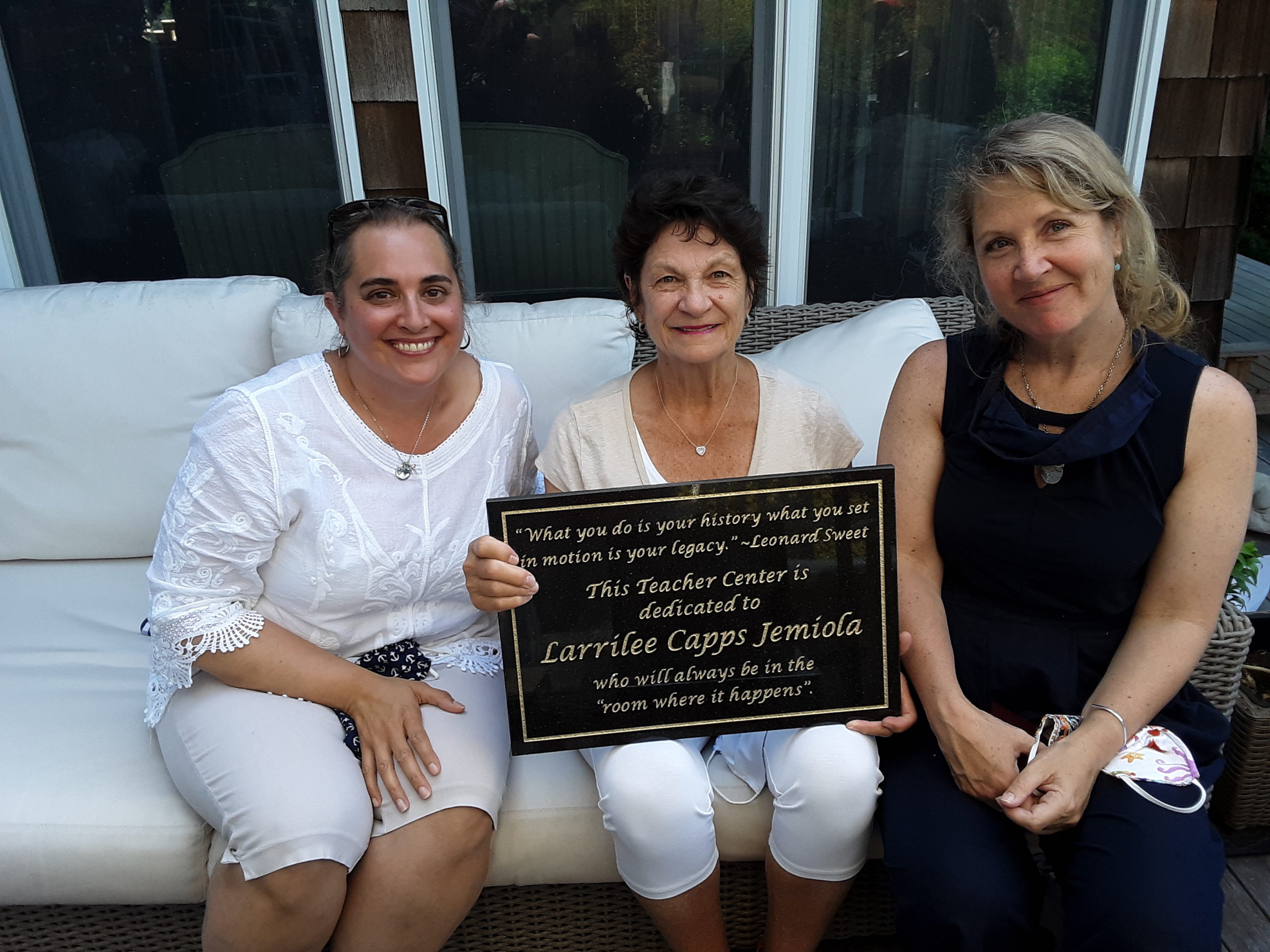 Larrilee Jemiola, an East Hampton resident who is retiring after 51 years of service to the East End educational community, is celebrated at a recent Peconic Teacher Center policy board meeting by new Co-Directors Kim Milton and Kelly Anderson. 