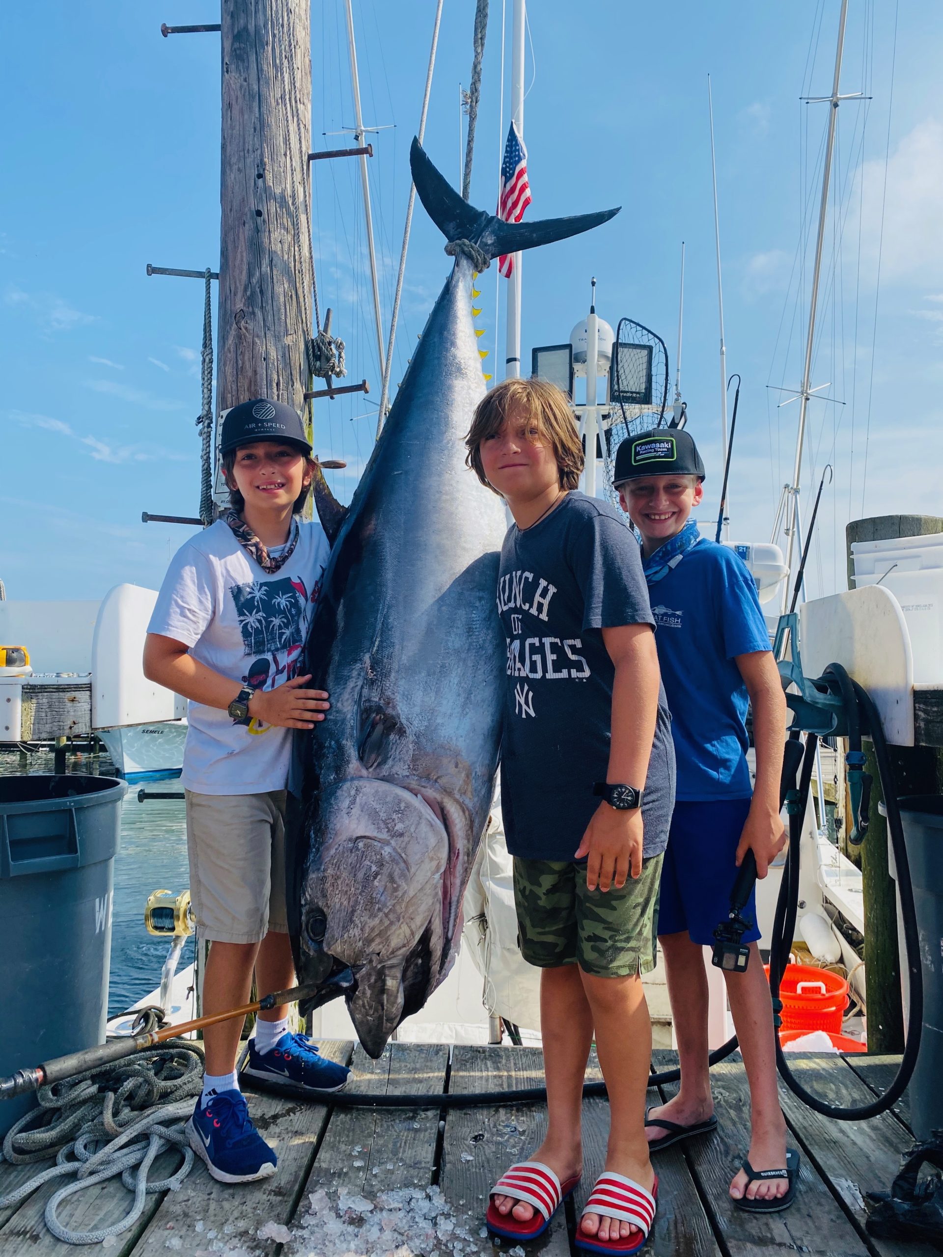 Leo and Massi Mancinelli and Brayden Fromm pose with the 240 pound bluefin tuna they caught while fishing aboard the Flying Dutchman off Montauk last week. 