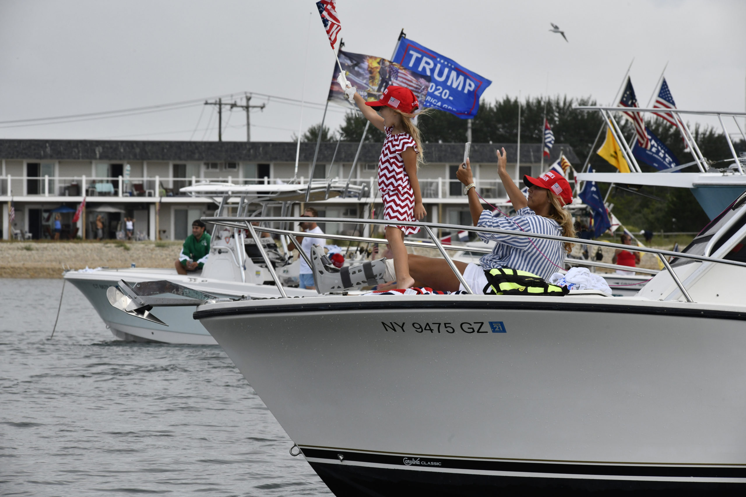 Supporters of President Donald Trump gather in Fort Pond Bay on Friday afternoon. 