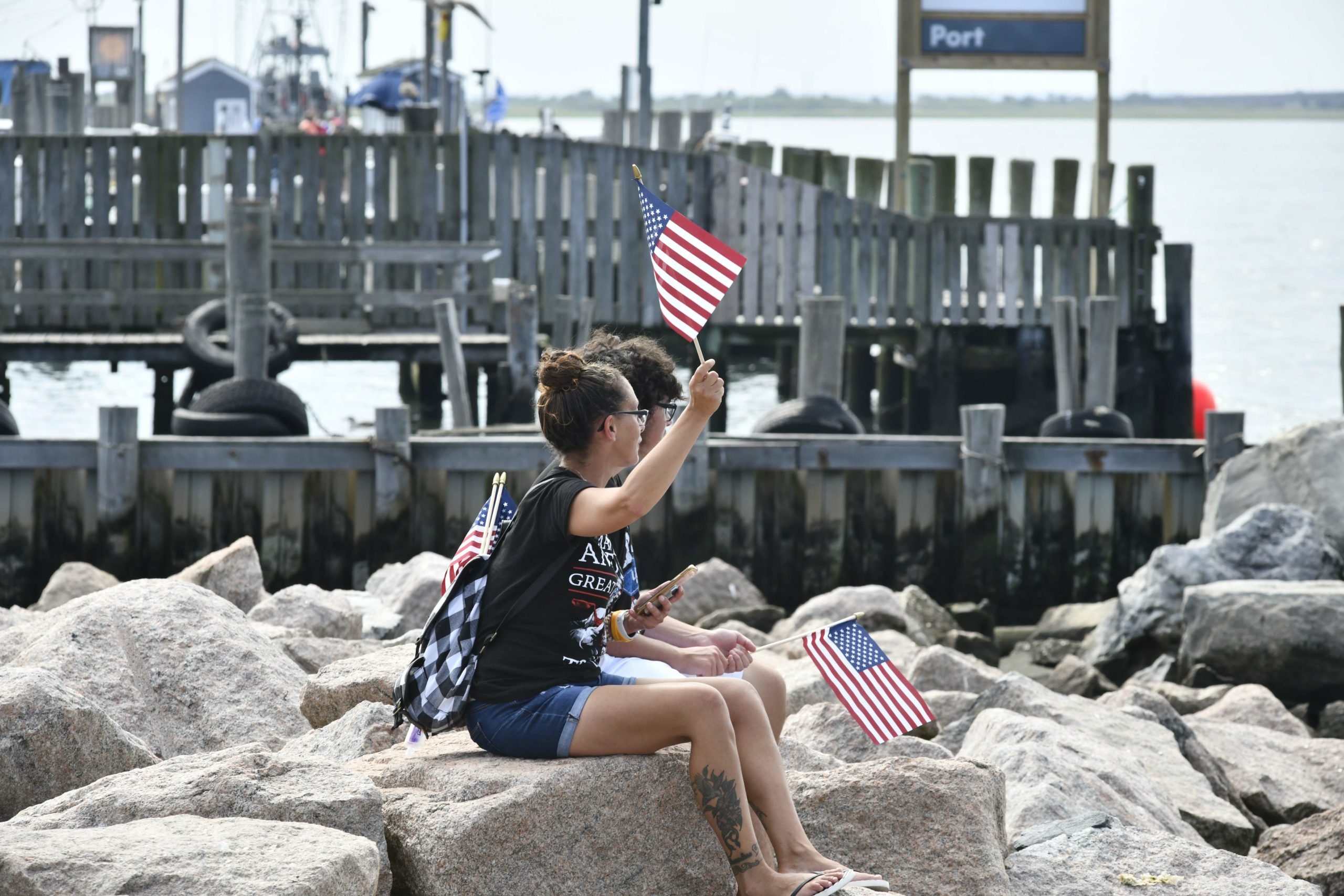 Supporters of President Donald Trump line the jetties, docks and bridges in Hampton Bays on Sunday. 