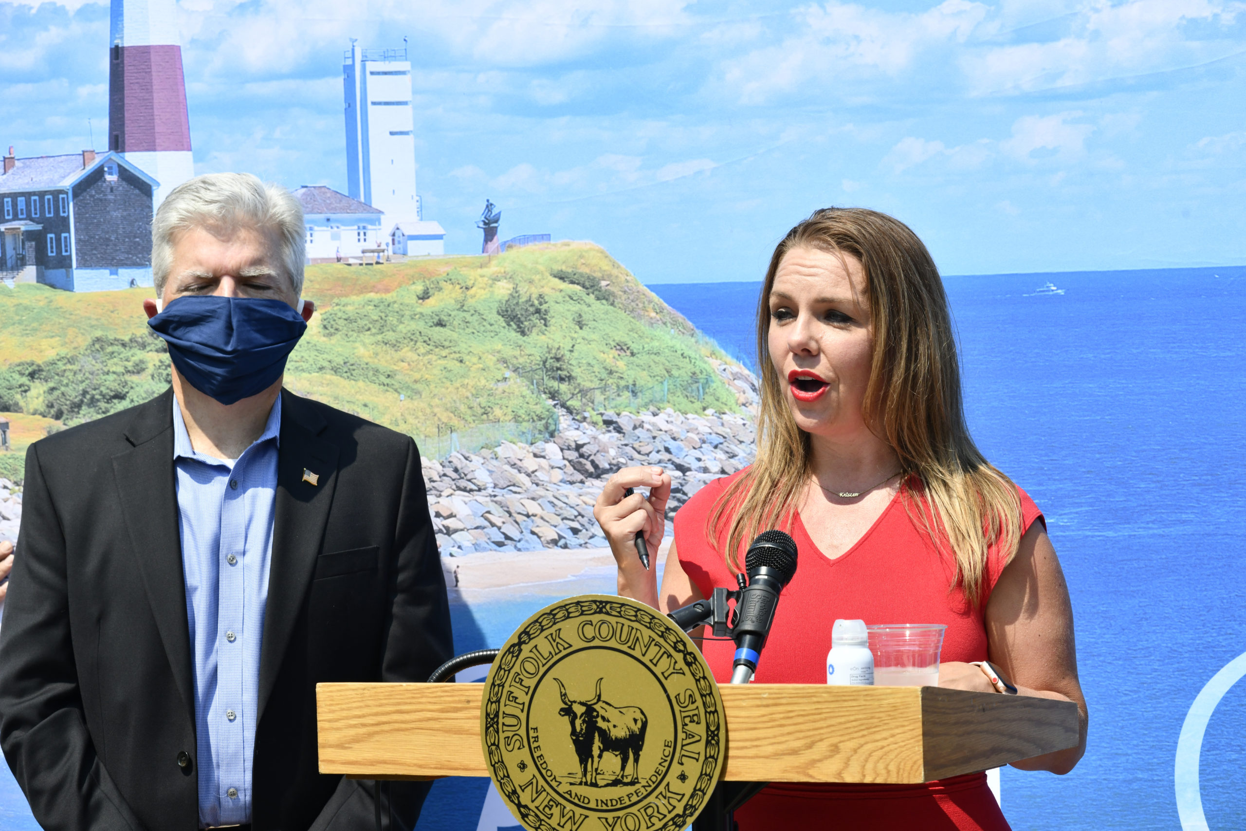 Suffolk County Executive Steve Bellone and Discover Long Island President and CEO Kristen Jarnagin speak at the Capri Holtel in Southamtpon on Thursday afternoon. DANA SHAW