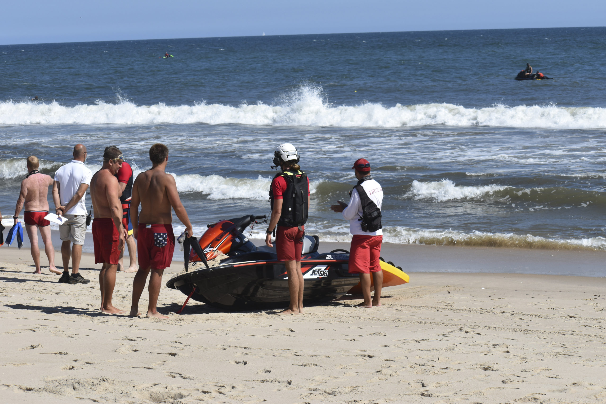 Members of the East Hampton Volunteer Ocean Rescue, police and the U.S. Coast Guard continue to search for a missing swimmer on the beach between Napeague State Park and Hither Hills Tuesday afternoon.   GAVIN MENU