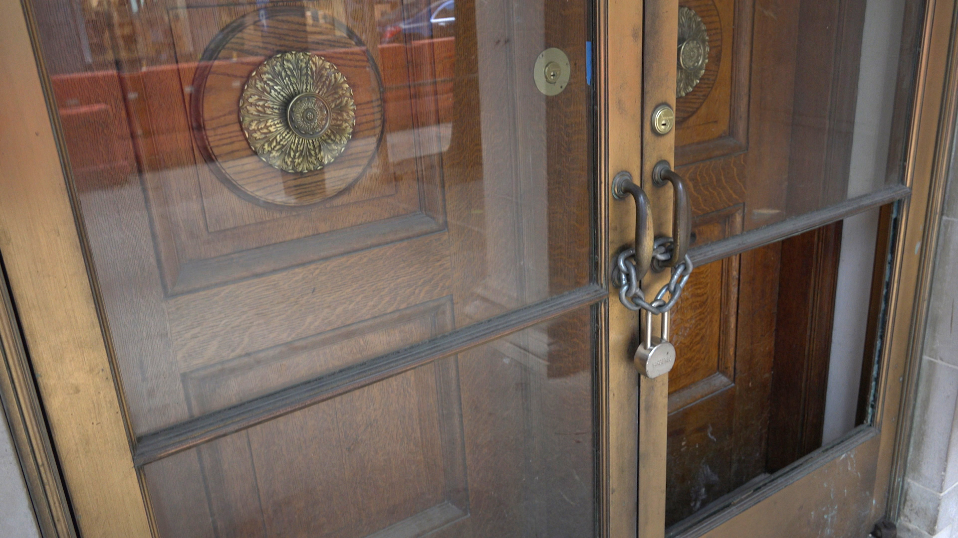 The locked doors of the Knoedler Gallery in Manhattan from the film 