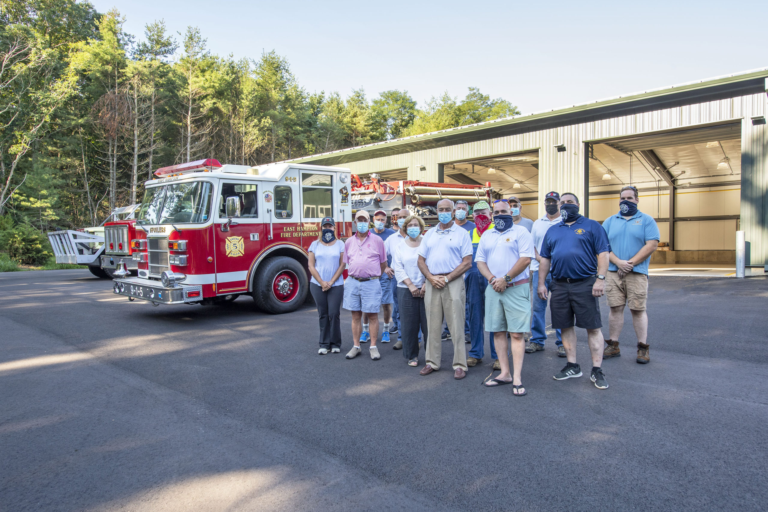 East Hampton Fire Department Chief Gerard Turza, Jr., his Assistant Chief Duane Forrester and EHFD officers welcomed members of the East Hampton Village Board as trucks 9-1-5, 9-1-10 and 9-1-13 were moved into the brand new EHFD Substation on Old Northwest Road on Saturday.  MICHAEL HELLER