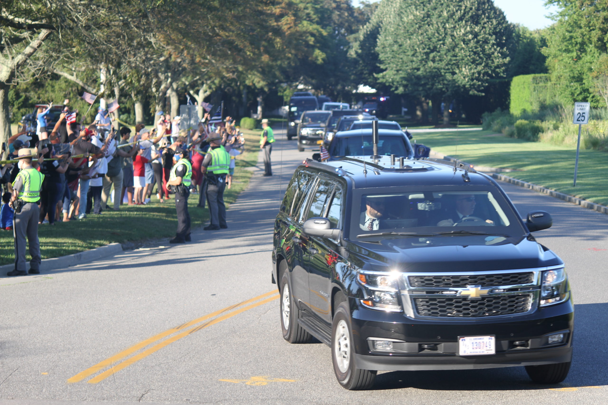 The president's motorcade and police escorts roll down Wickapogue Road in Southampton Village. 