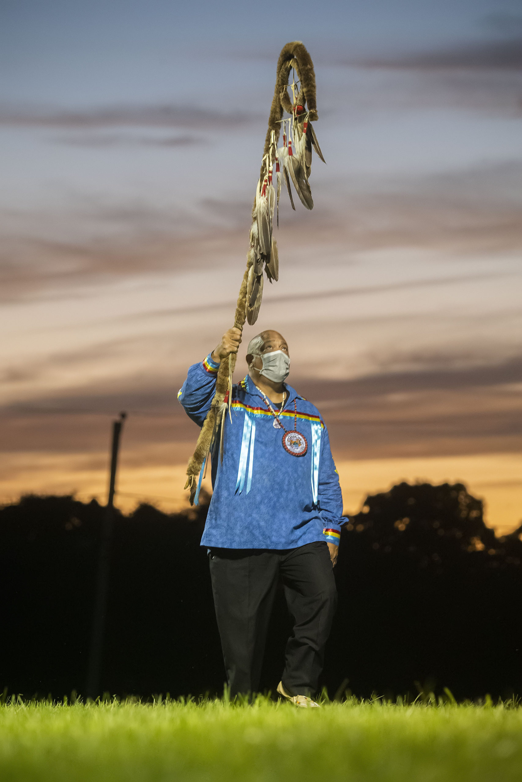 A Shinnecock tribe member participates in the opening ceremony of the 74th annual Shinnecock Indian Powwow on Friday night.