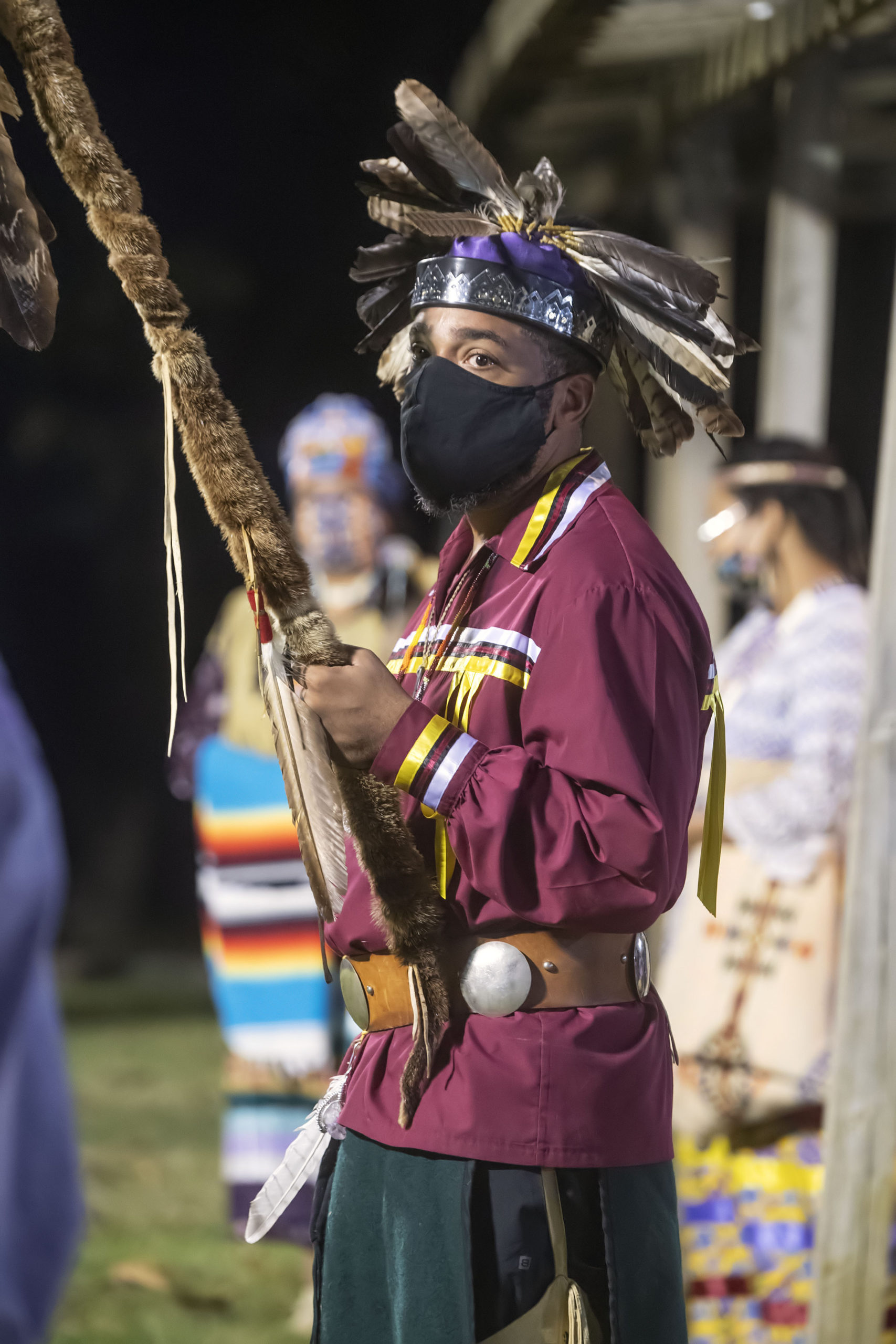 Bryan Polite watches at the opening ceremony of the 74th annual Shinnecock Indian Powwow on Friday night.